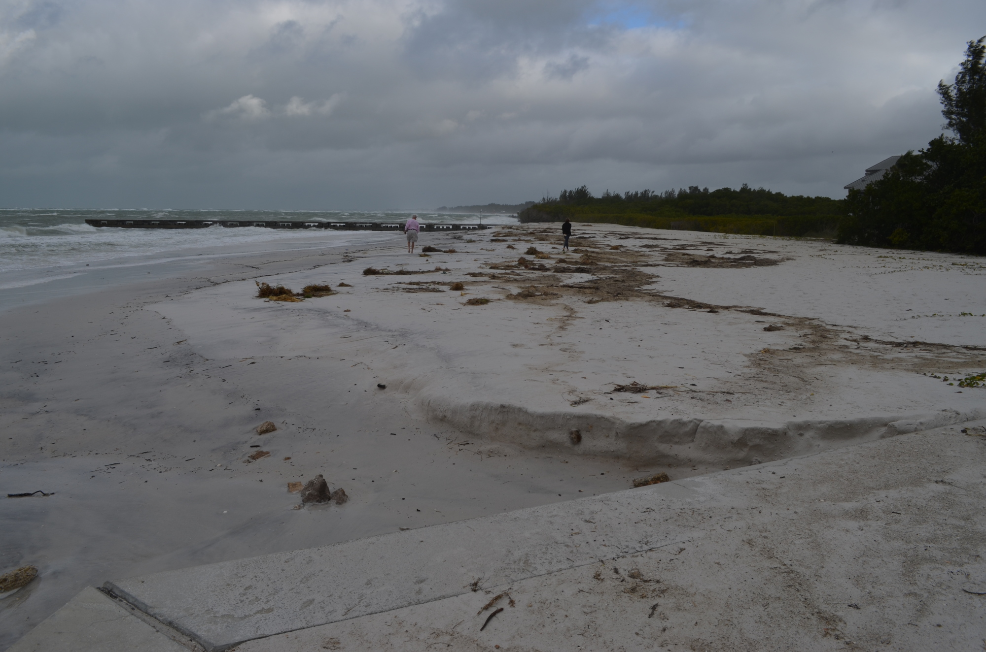 Strong storms and winds continue to pummel the north end of Longboat Key Sunday at the North Shore Road beach access, causing sand to recede between two groins constructed in the area to hold sand.