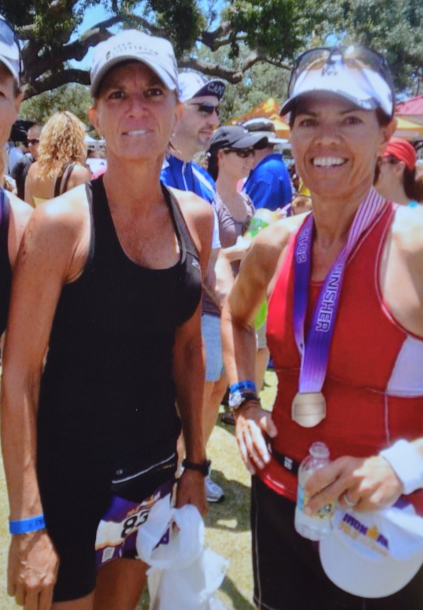 Courtesy photo. Sharon Butler and Eve Goldberg were best friends and each other's fiercest competition in local triathlons. Here they are after crossing the finish line at the 2012 Ironman half marathon.