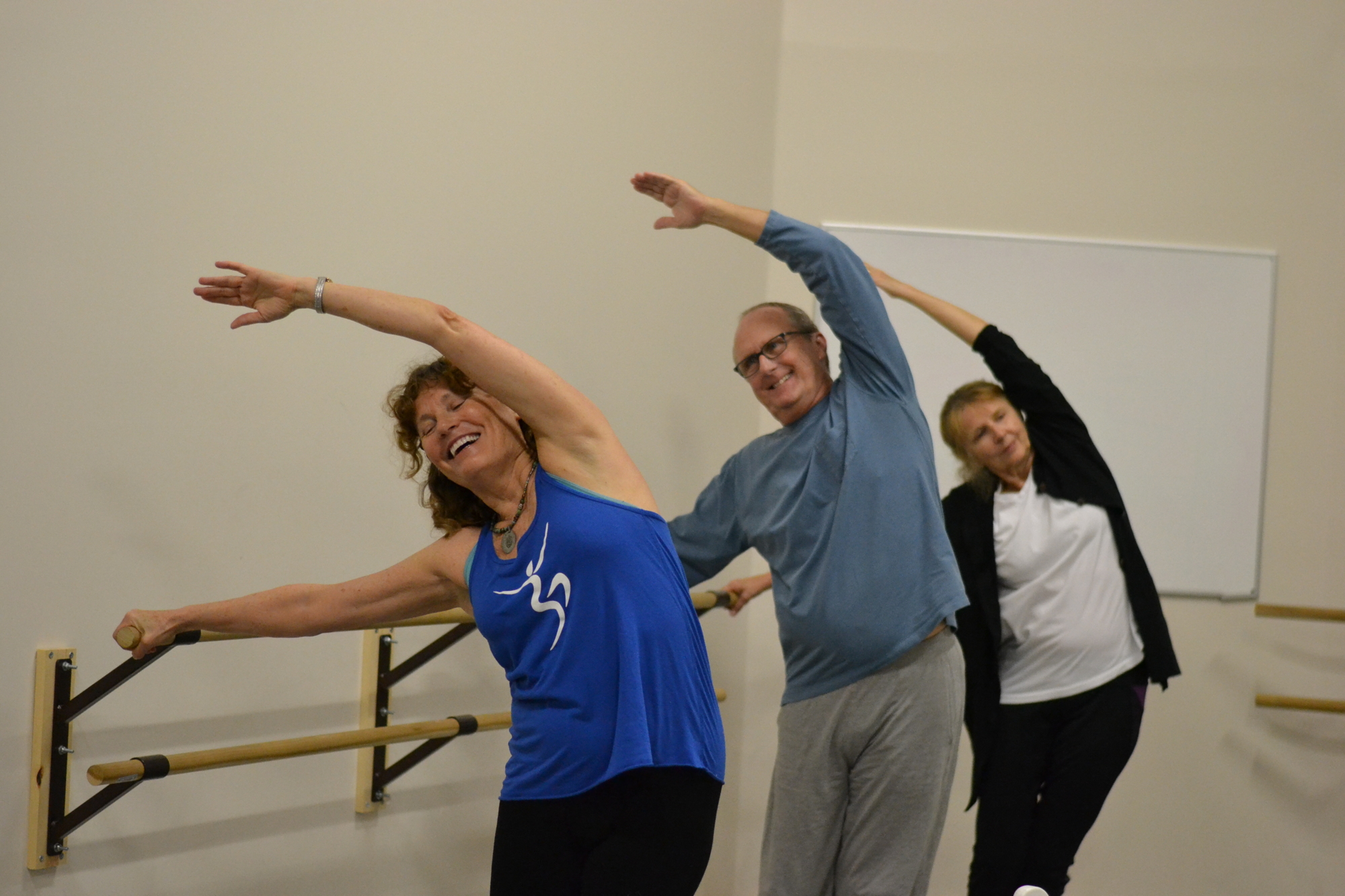 Megha-Nancy Buttenheim leads the Let Your Yoga Dance class at the barre through stretches.