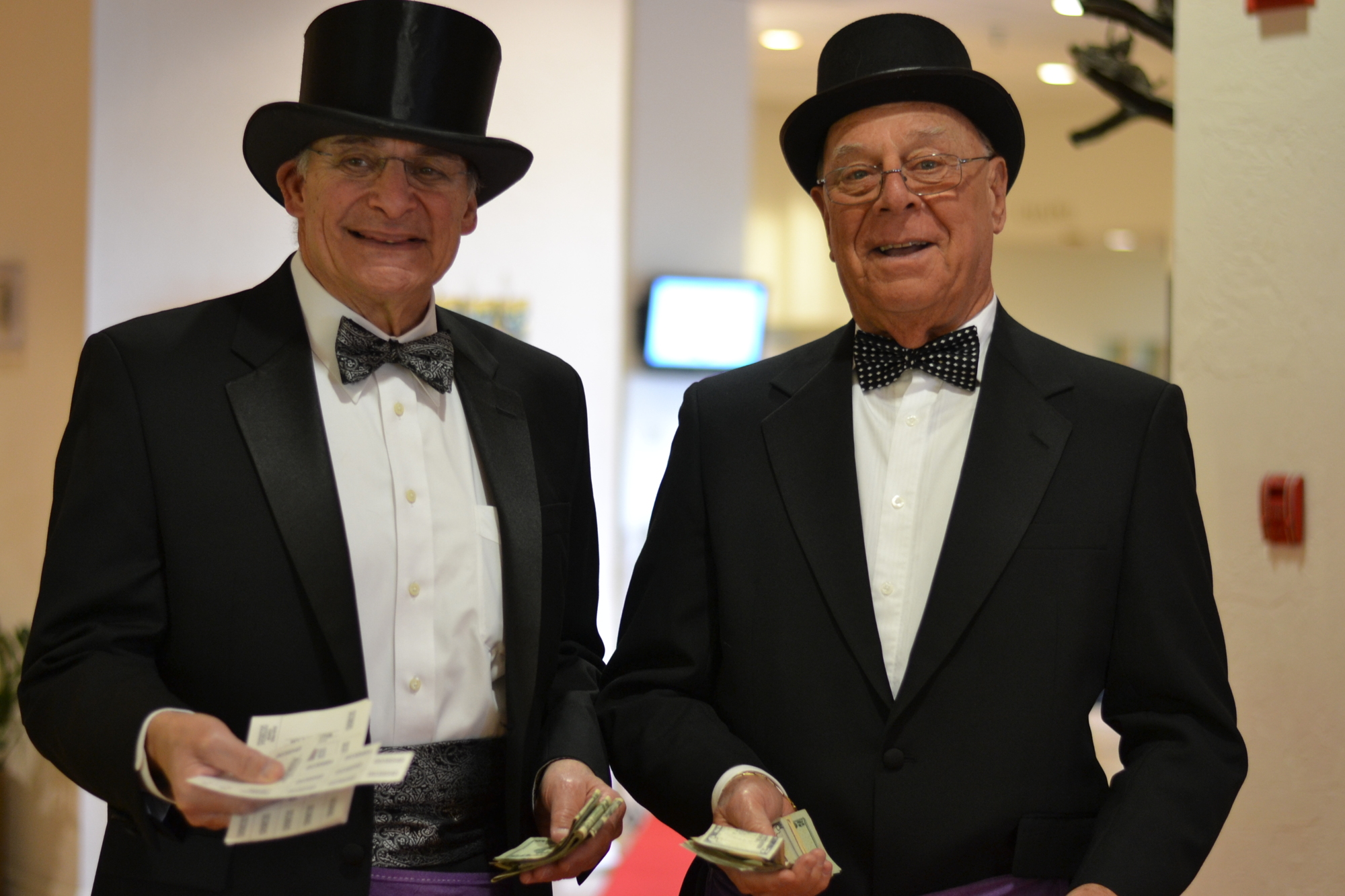 Fred Bloom and Larry Lerner dressed to kill and hustling chances at the Beth Sholom Sisterhood luncheon. Photo by Amanda Morales