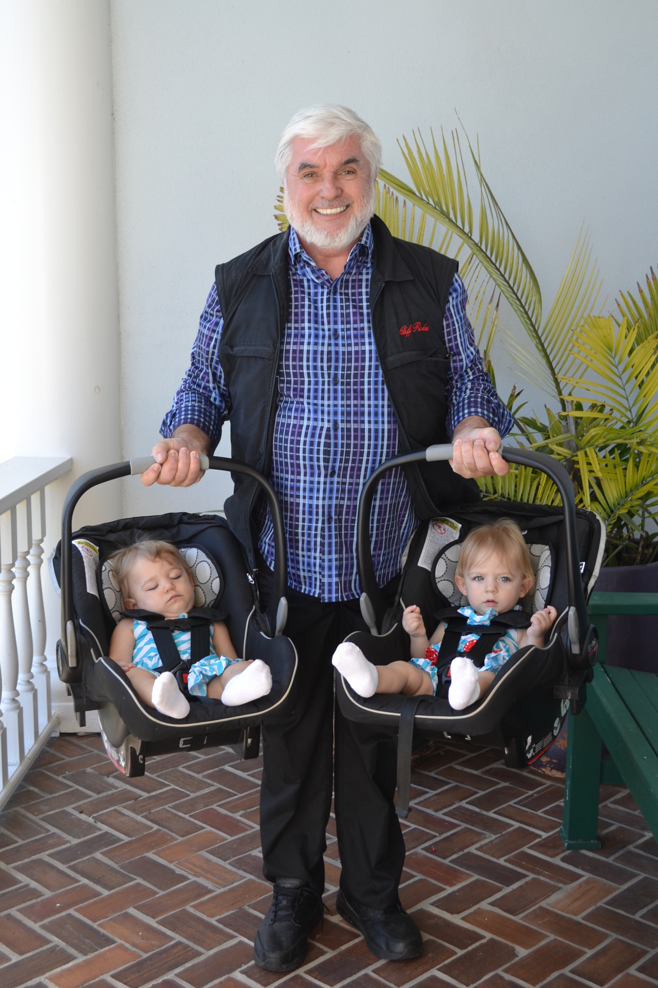 Birthday boy Cliff Roles with granddaughters Emery (sleeping) and Aslin Bikfalvy. Photo courtesy of Cliff Roles