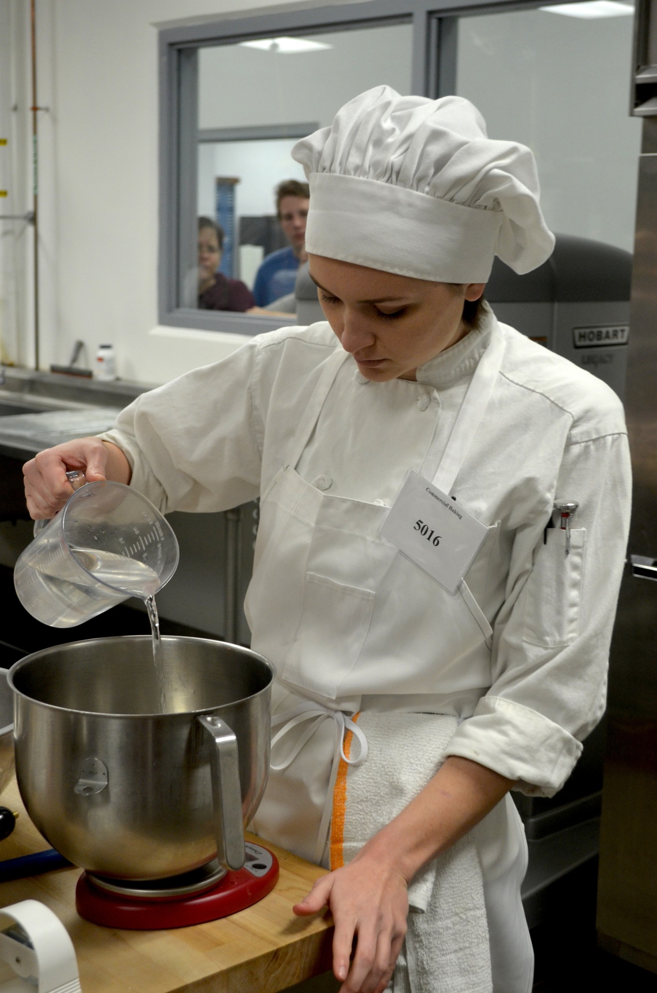 Manatee Technical College student Matika Liptrot measures ingredients for a recipe she's cooking.