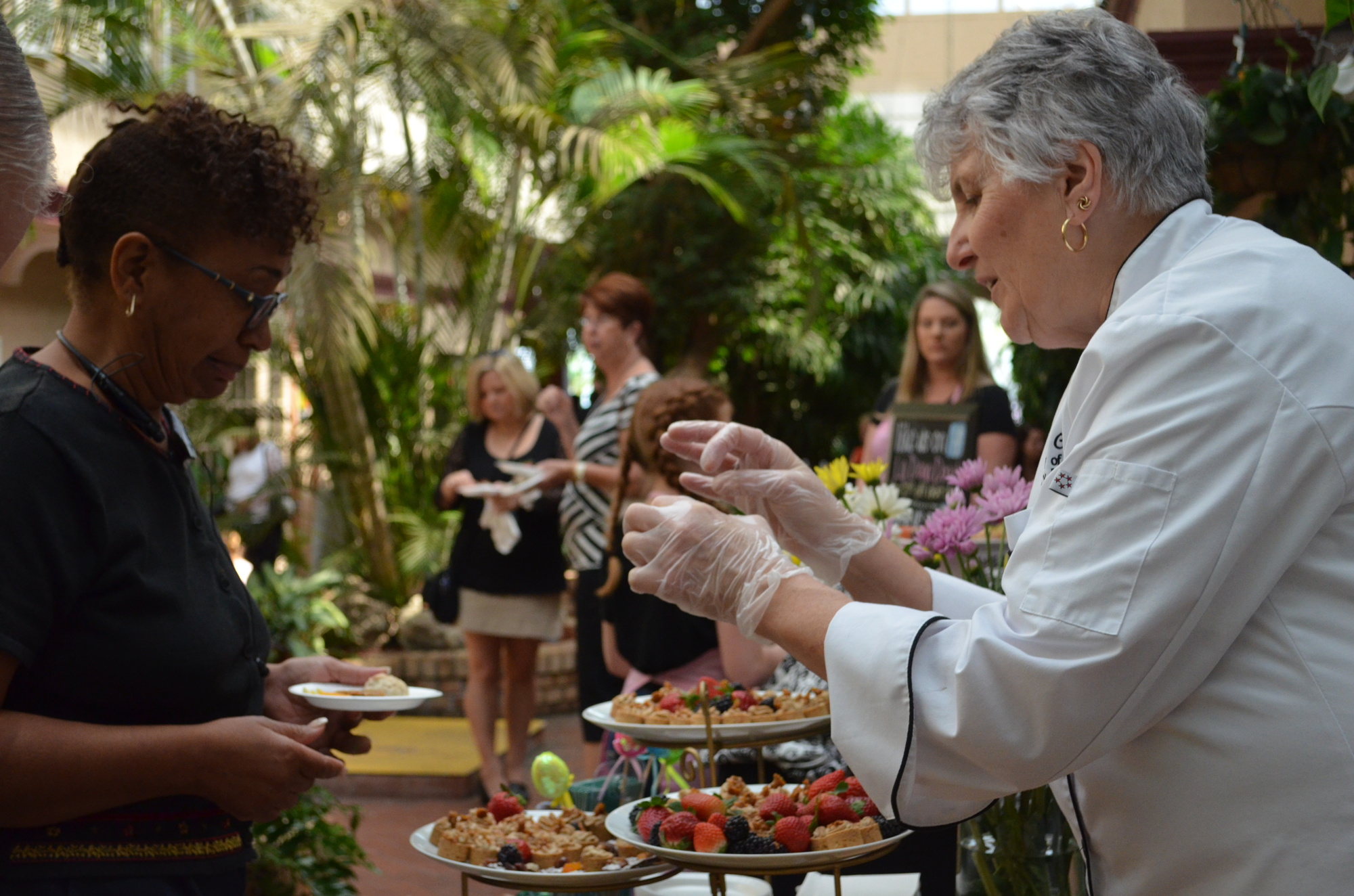 Anna Castellina discusses the sweet and savory spread from the University of South Florida Culinary Innovation Lab during the UCP Chocolate Sundae & Food Festival.