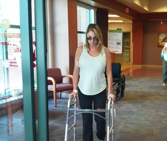 Cintia Manasseh-Caputo walked out of the rehabilitation hospital with a walker July 10, despite warnings she may not walk for a year or more. Courtesy photo.