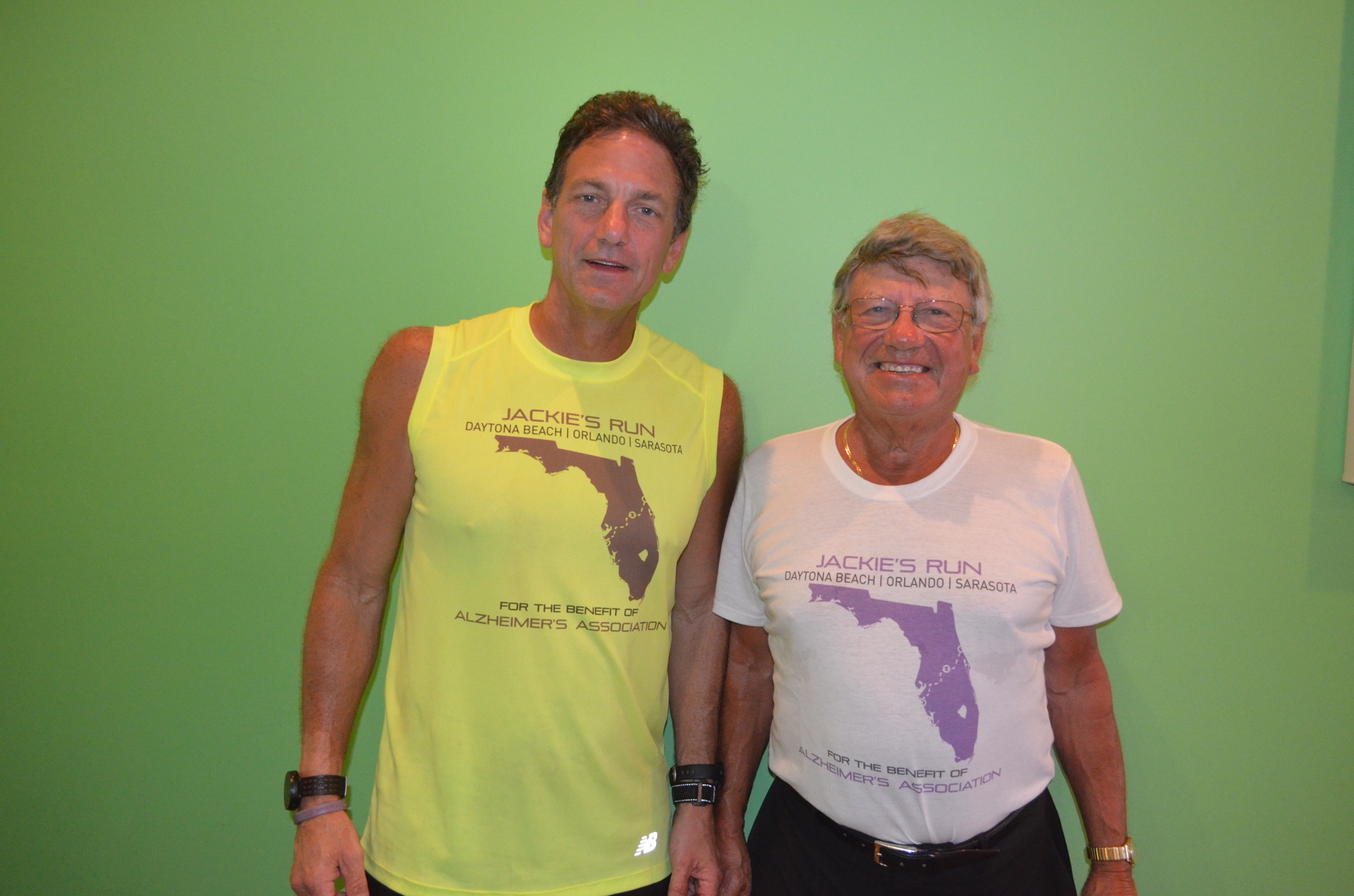 Steve Schwalbach and his father, Garry, celebrate the end of his run across Florida March 18, at Daiquiri Deck.