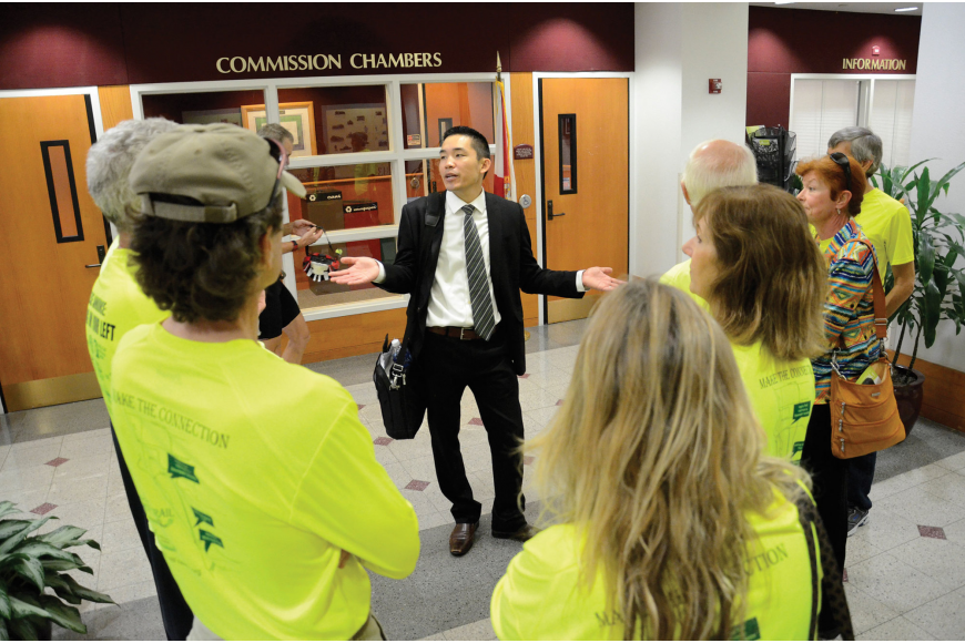 Patrick Lui, Sarasota County's bicycle, pedestrian and trails coordinator, addresses Legacy Trail supporters at a County Commission meeting in 2015.
