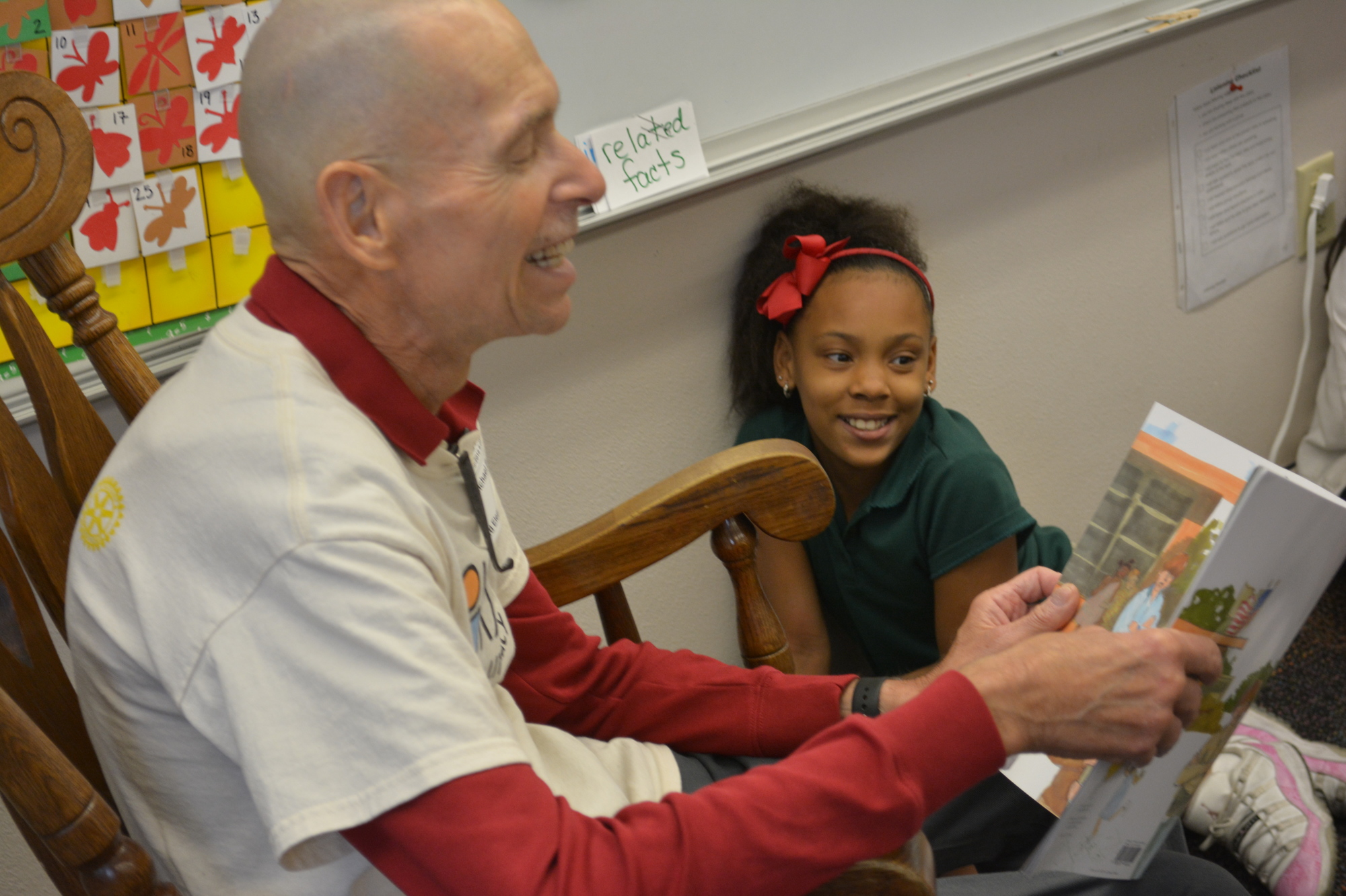 Michael Berlow, a retired physician and a Lakewood Ranch Rotary Club volunteer, reads to third-grader Bella Diaz as part of the Books for Kids program.