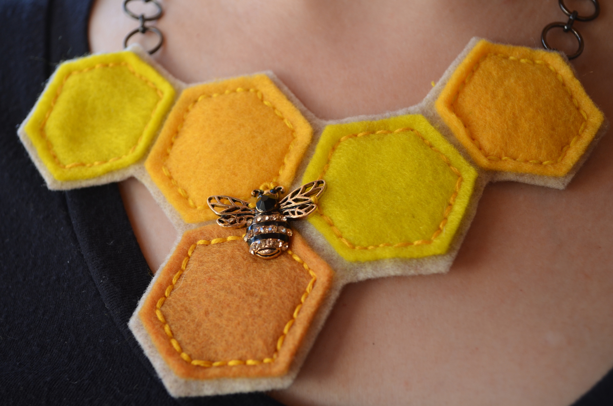 Mimi Cirbusova's original bee and honeycomb necklace