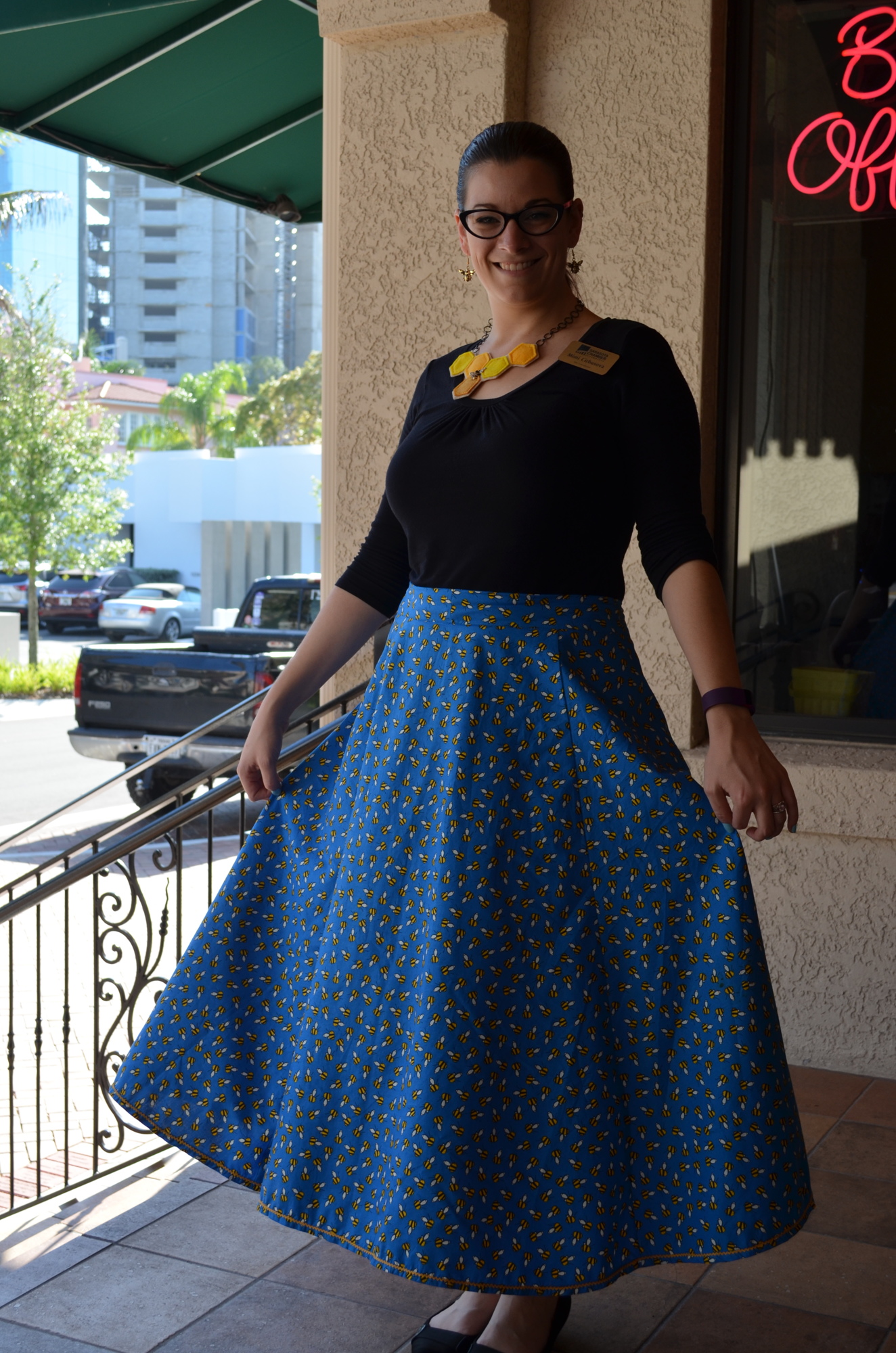 Mimi Cirbusova's  outfit for the YPG Spelling Bee included a skirt with a bee pattern, a honeycomb necklace and matching bee earrings.