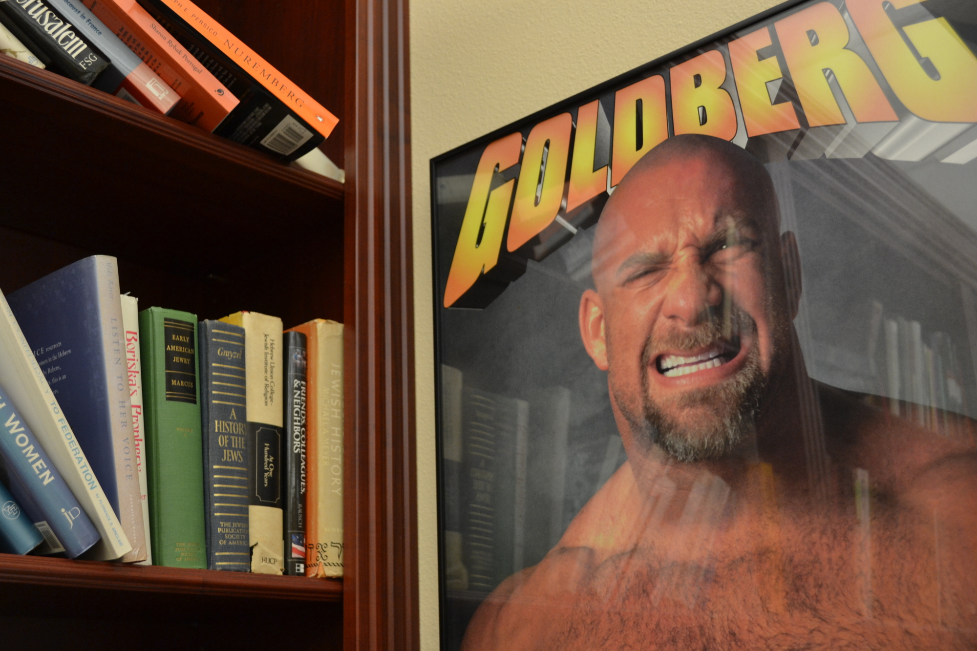 A poster featuring  WCW wrestler Bill Goldberg is on display in Huntting's office as a gift from his son Gabe.
