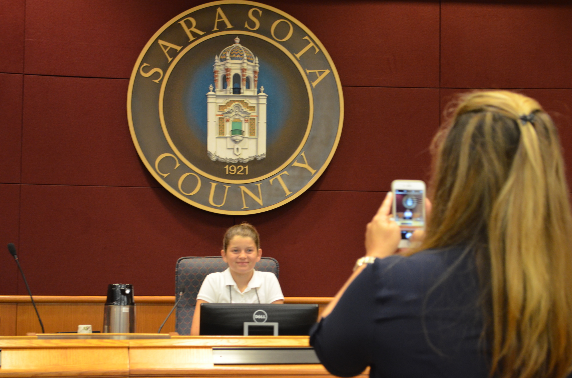 Kiersten Pedersen brought her daughter Alexi Hornacek to work for the third year. Every year they take a photo of Hornacek sitting in the Sarasota County Commission chambers.