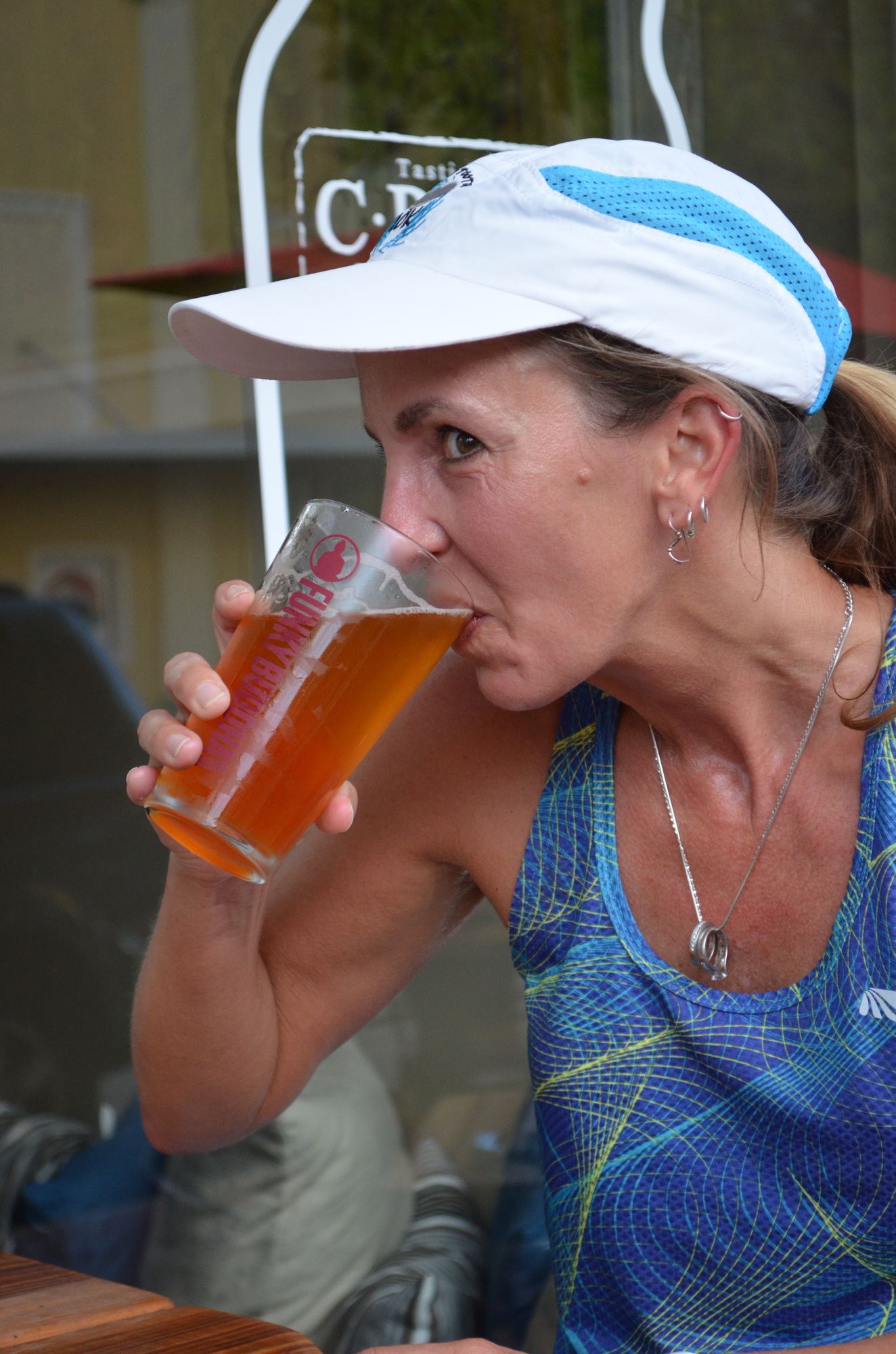 Lori Dunlap sips on the Soul Style IPA form Green Flash brewing after her run with the Brew Crew at Craft Growlers To Go Tasting Room.