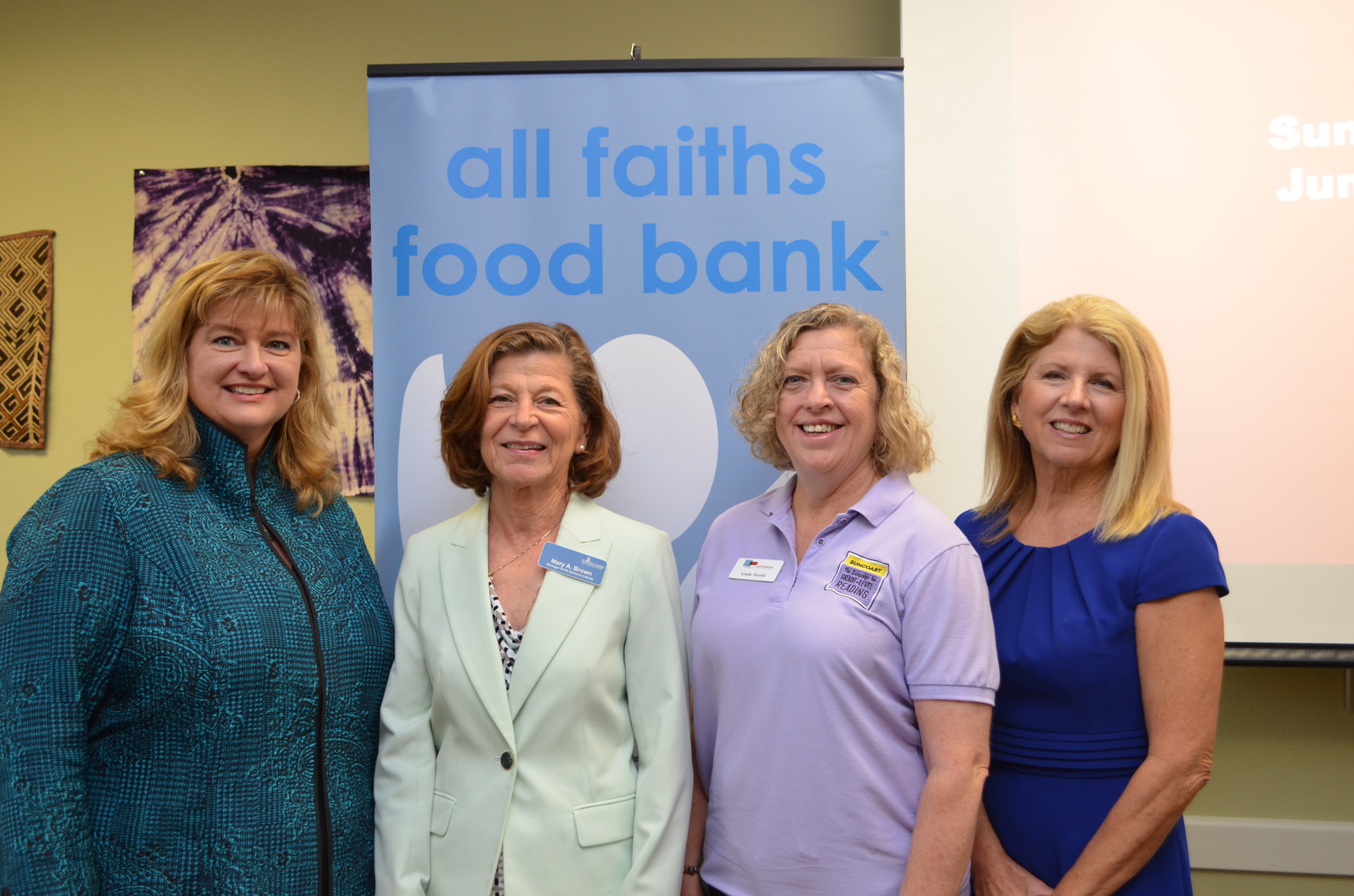 Sarasota County Schools Food and Nutrition Services Beverly Girard, North Sarasota Library Manager Mary Brown, Linda Gould and All Faiths Food Bank CEO Sandra Frank.