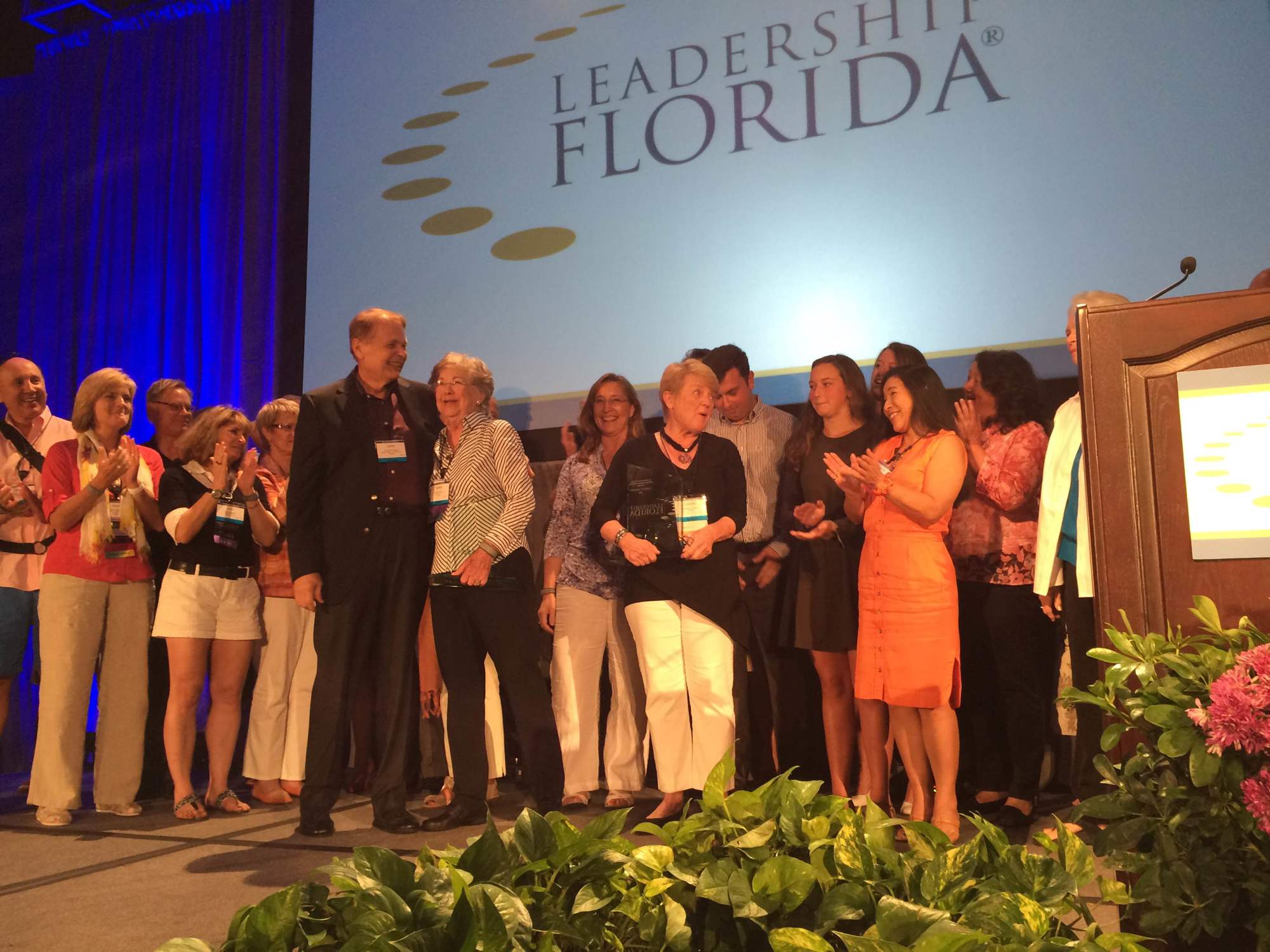 Carolyn Johnson and Isabel Norton winning the Leadership Florida Distinguished Member Award in Orlando.