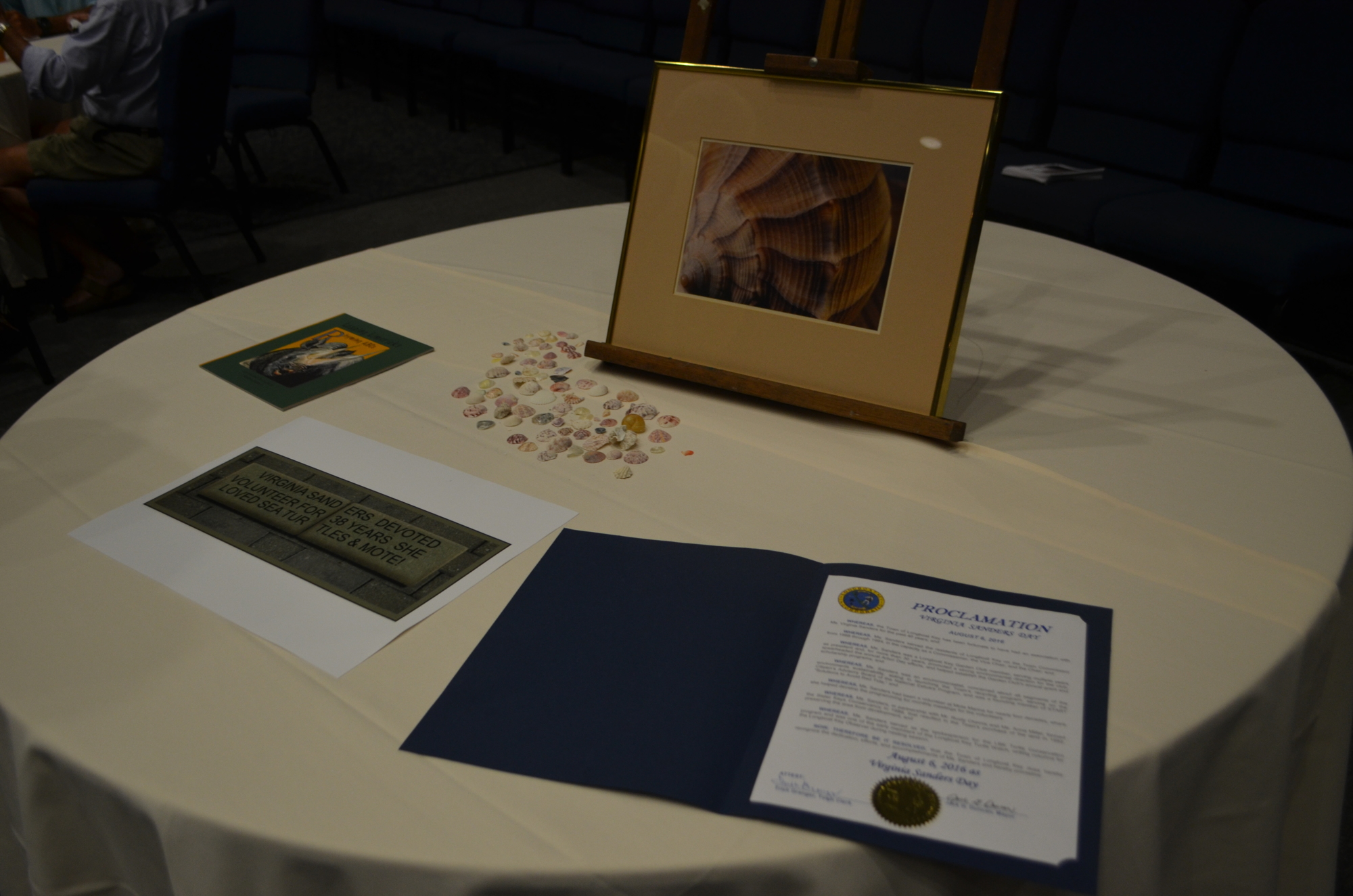 A table holding a photograph of the brick that will be placed in Mote's garden in her honor and the proclamation stating Aug. 6 as 