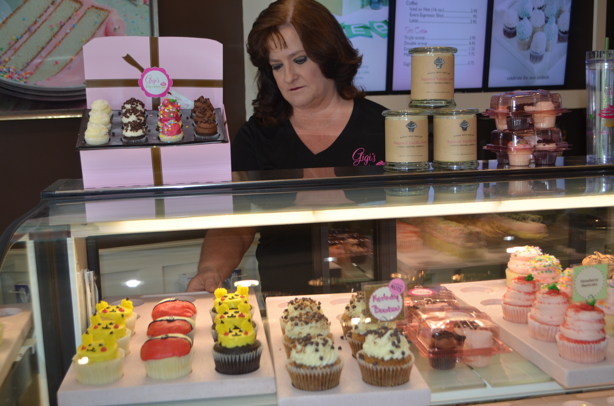 Dorrie Rubinstein puts the Pokémon cupcakes on display. The cupcakes have been a big hit for the shop, which is a gym on Pokemon Go.
