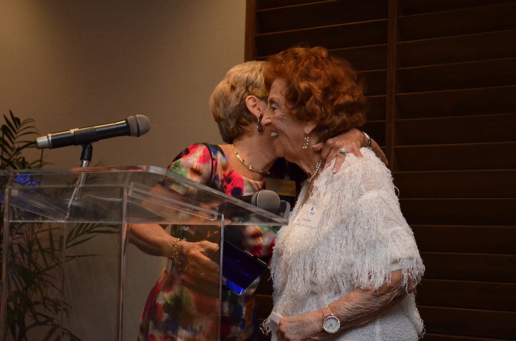 Skirboll embraces Hartka after awarding her with the Bernice “Bunny” Skirboll Award for Outstanding Compeer Board Member for the year of 2015 at the 5-year anniversary celebration luncheon on March 31, 2016 at The Francis. Photo by Amanda Morales.