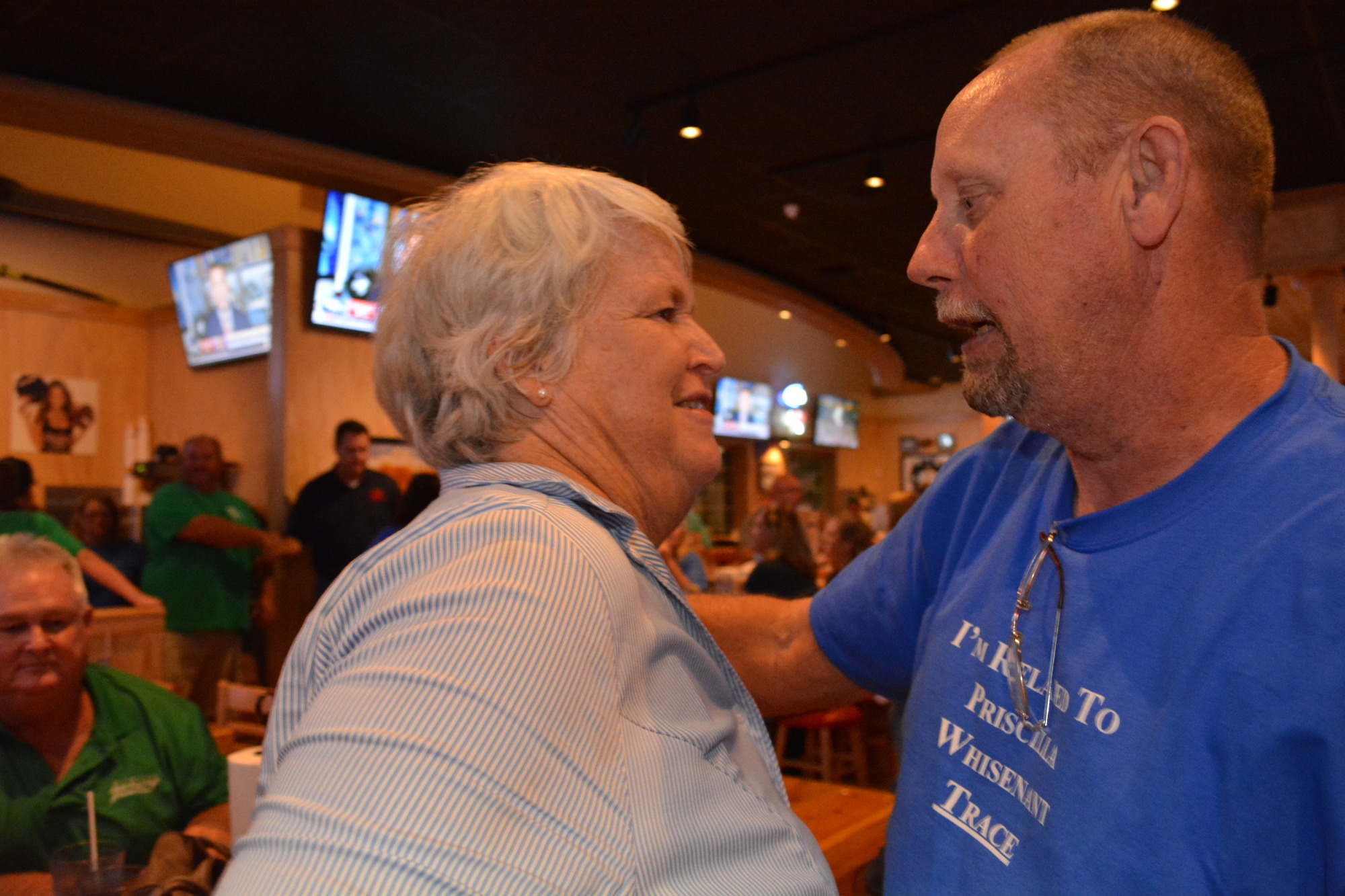 Priscilla Whisenant Trace receives congratulations from Rick Wood after winning the District 1 commissioner's Republican Primary.