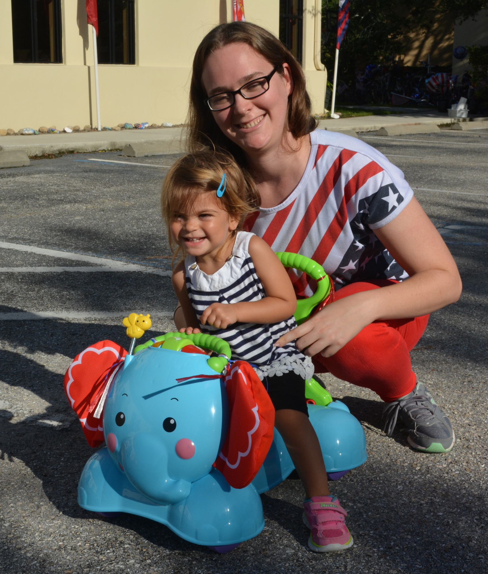 Two-year-old Elena Madrigal rolls away from teacher Samantha Correia.