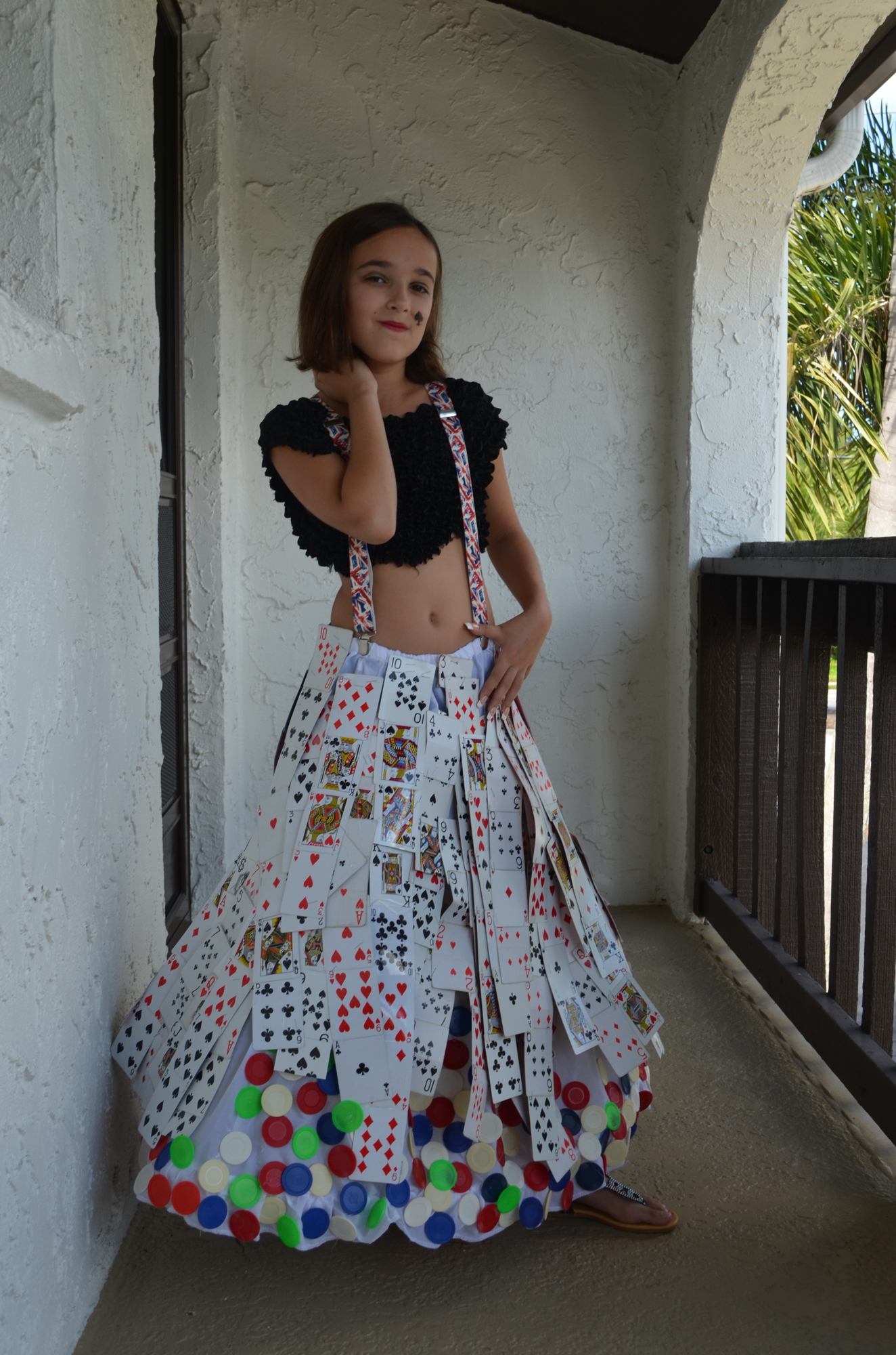 Sophia Cusumano, 10, models her poker-inspired dress at the iconcept jr. photoshoot. Photo by Niki Kottmann.