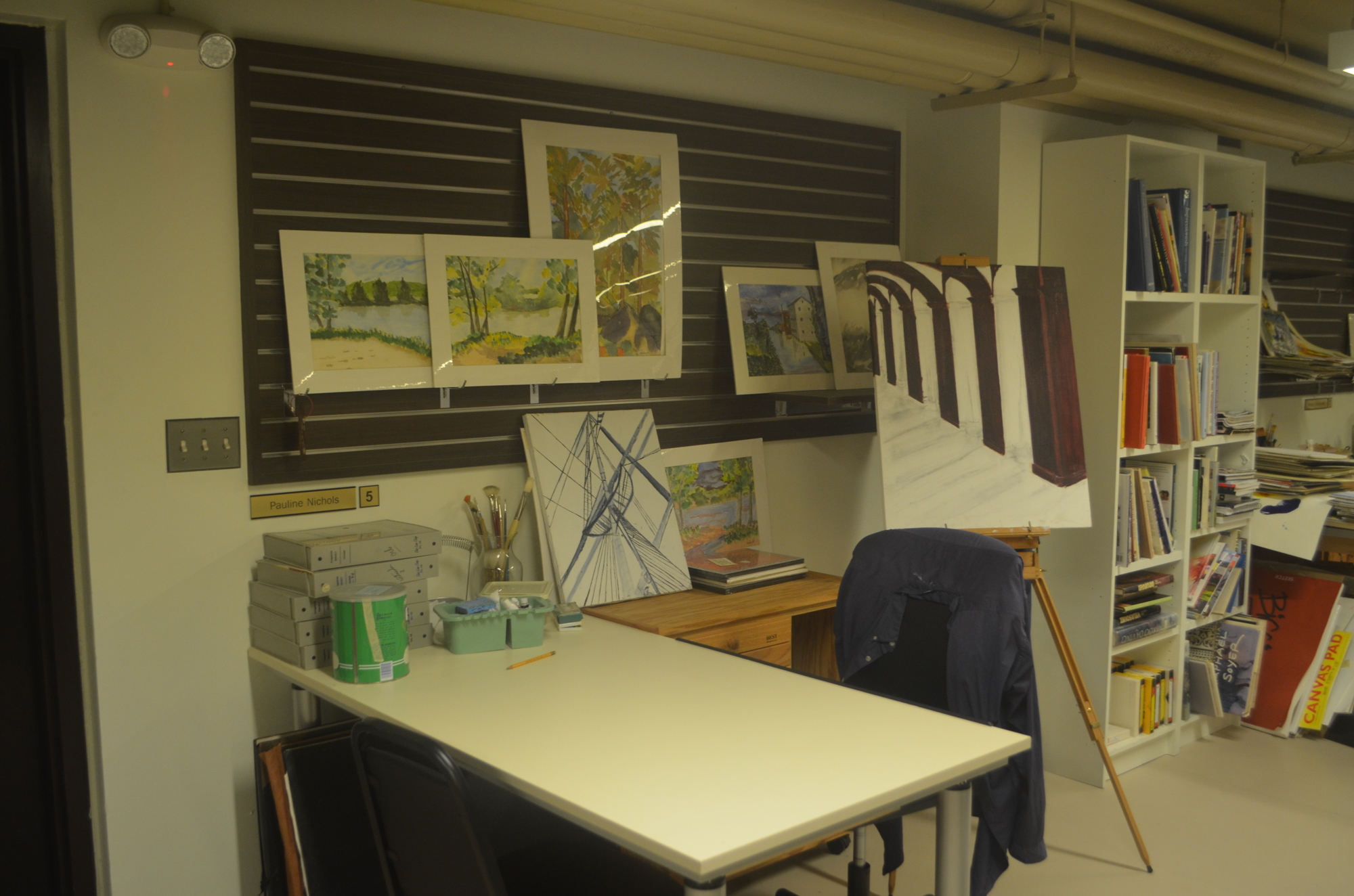Pauline Nichols' work space in the art room of Plymouth Harbor. She hopes to finish a painting of Italy next.