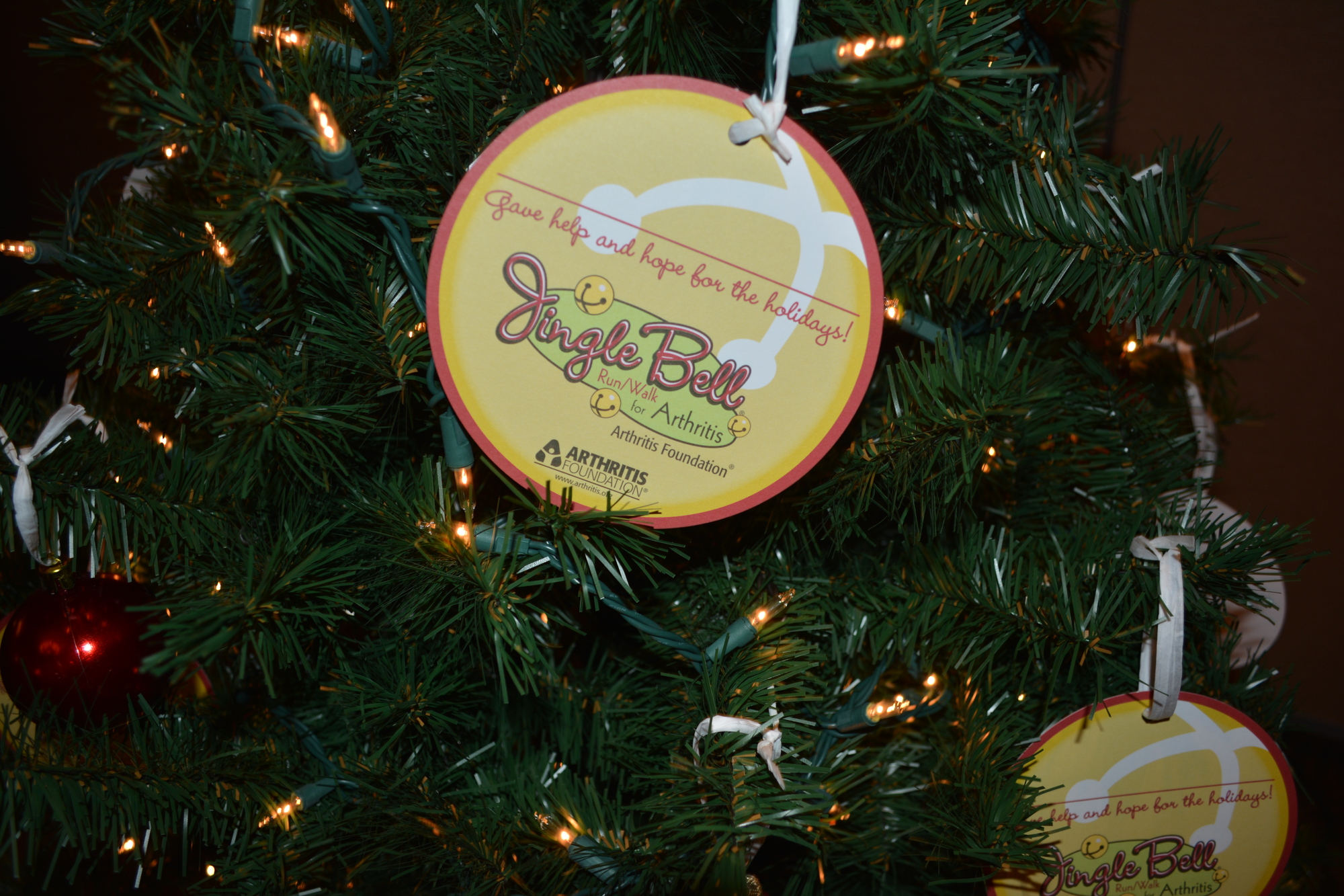 A Christmas tree on Wednesday at the Polo Grill & Bar announced the Jingle Bell Run returns to Lakewood Main Street Dec. 3.