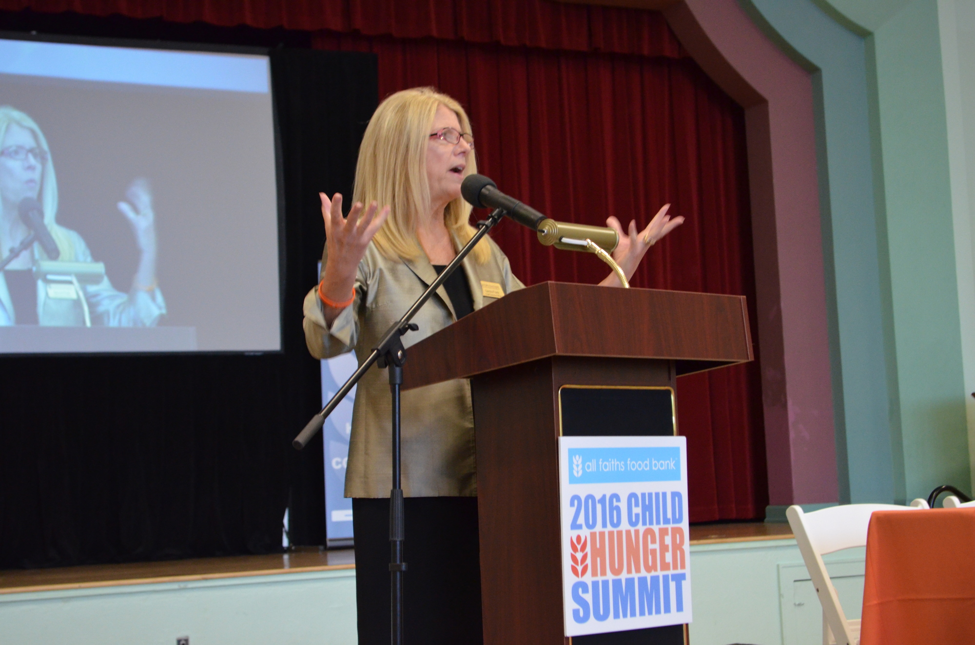 All Faiths Food Bank CEO Sandra Frank addresses guests at the 2016 Child Hunger Summit Tuesday, Sept. 27 at the Sarasota Municipal Auditorium.