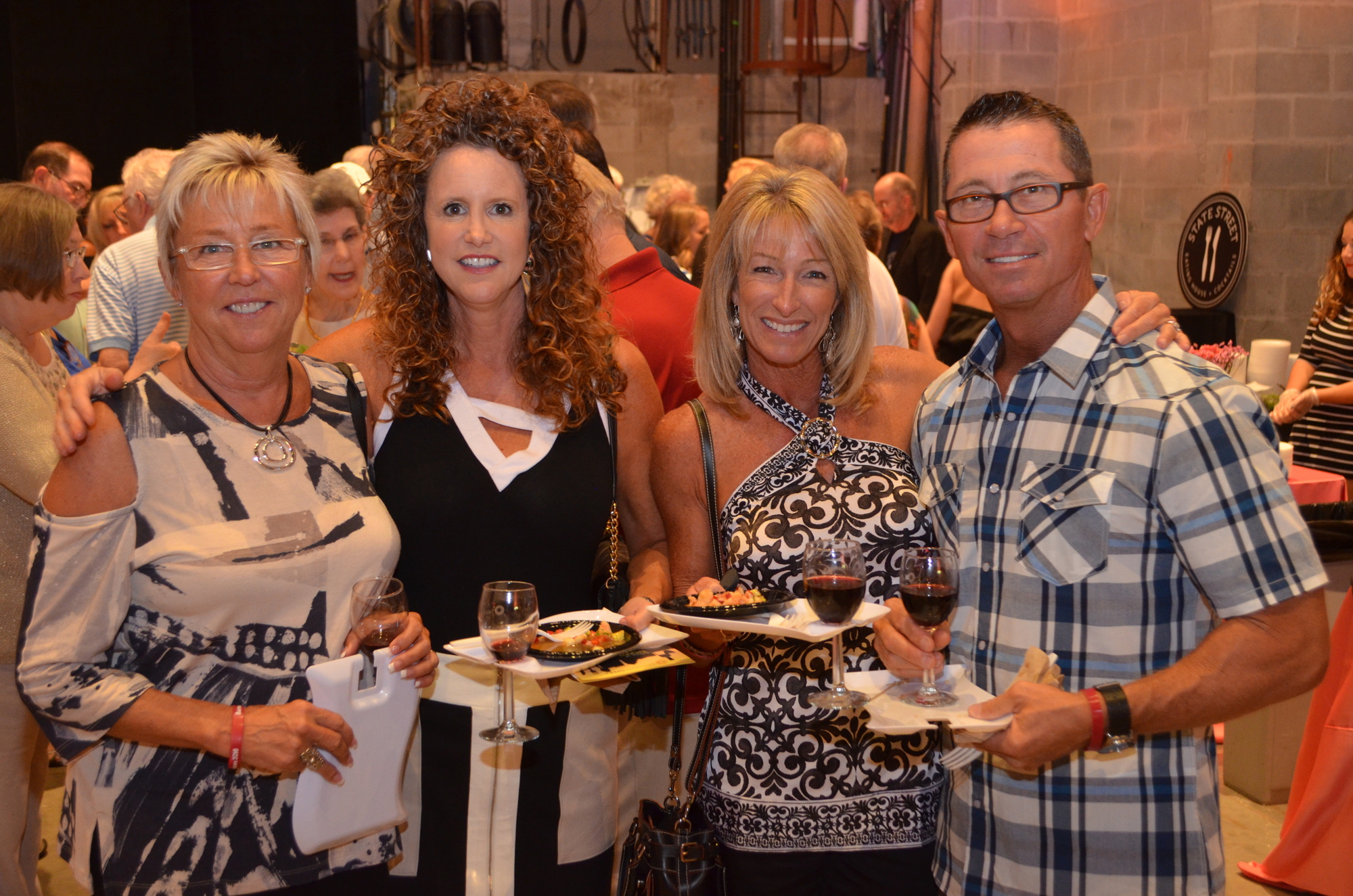 Sheree Damato, Lori Hill, Karen Larzelere and Tom Larzelere enjoy wine and food samples at the third annual A Taste of Downtown Food & Wine Festival at the Sarasota Opera House on Saturday, Sept. 10.