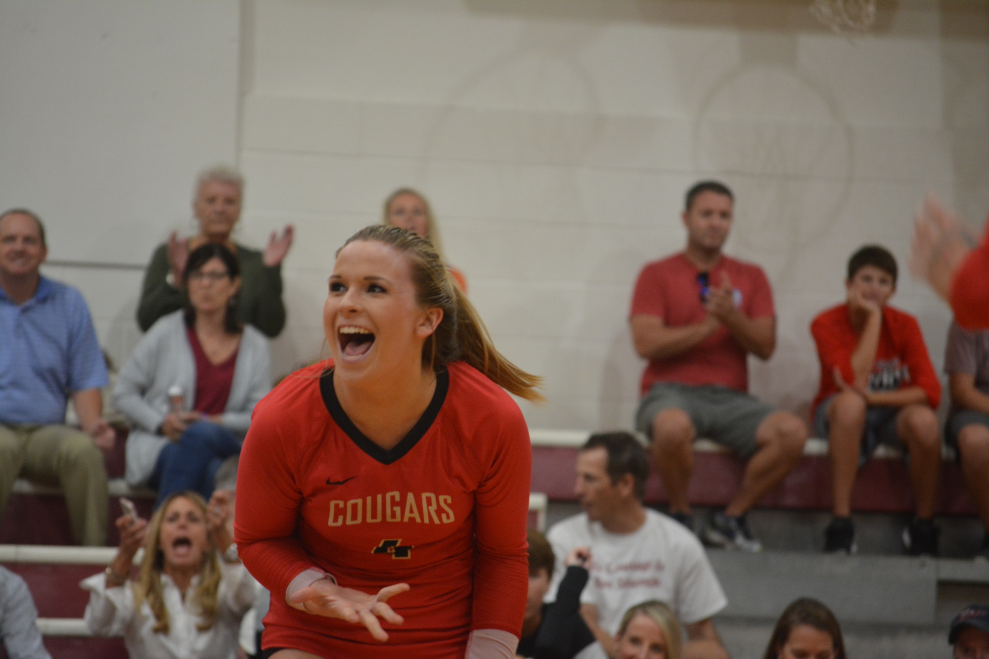 Cardinal Mooney senior Annie Shaw screams in celebration after the Cougars won a point against North Port on Senior Night.