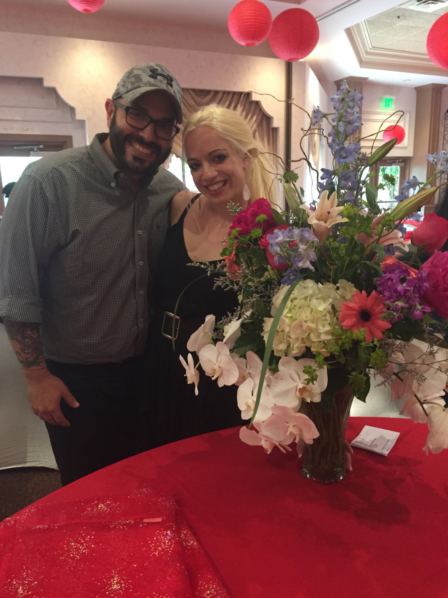 Roger Capote surprises dance partner Sarah Haworth with a bouquet of flowers at CANDance rehearsal. Courtesy photo.