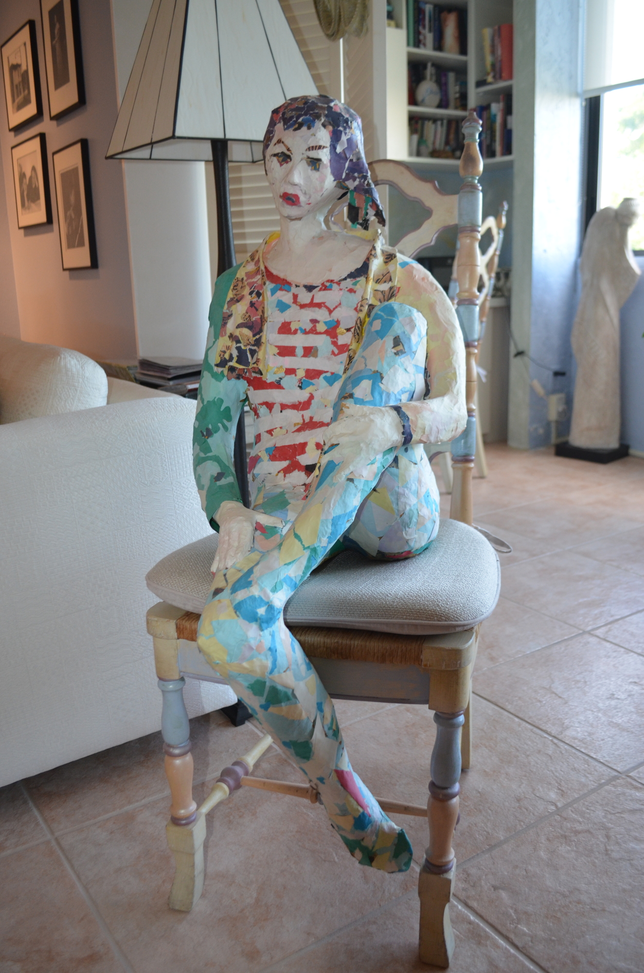 Levitt's home is filled with his artwork. This paper mache sculptures sits in a chair next to his living room.