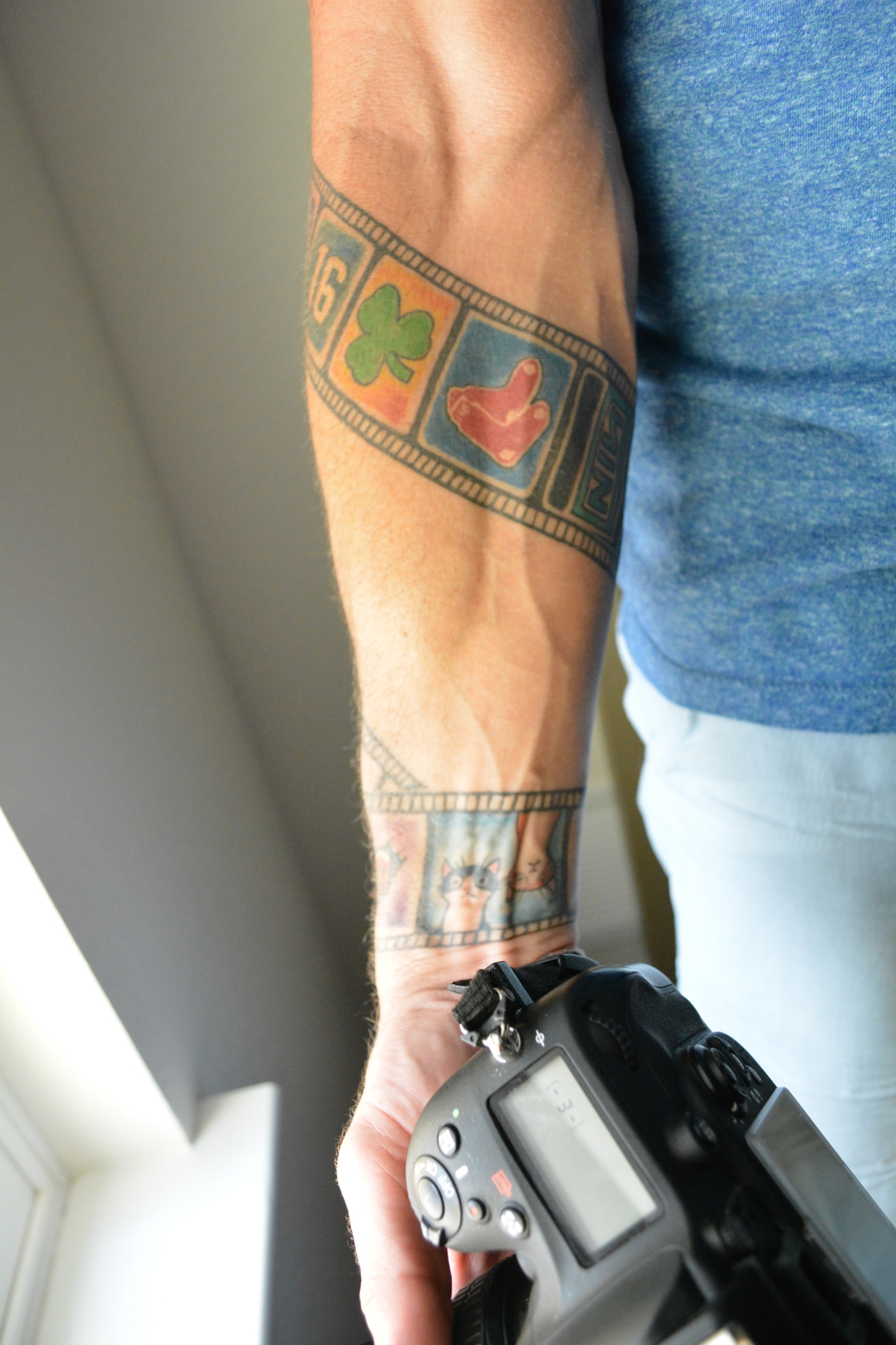 Thomas Cronshaw's film tattoo features things important to him, such as his U.S. Marine badge, images of his cats, lucky numbers and more.