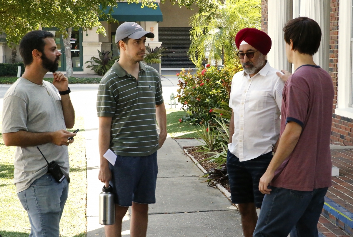 Cinematographer Nick Morgulis, writer Christian Long, actor Harry Anand and writer/director/actor Justin Long discuss a prank scene. Courtesy photo.