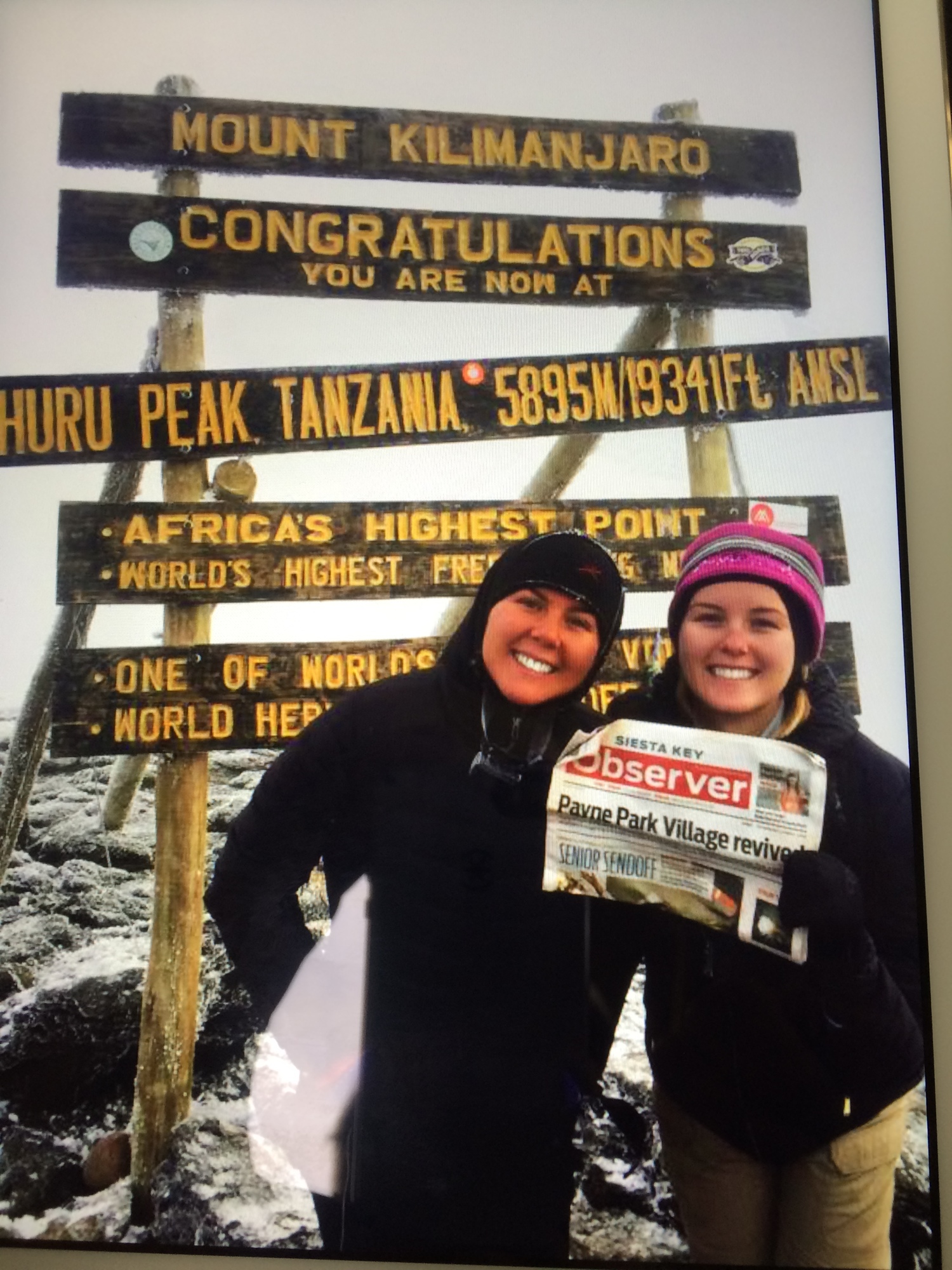 aylor and Sarah Karp climbed Mount Kilimanjaro with their Siesta Key Observer over the summer. The climb was to raise funds to build a new school in Tanzania. The Karps were there for the opening of the new school.