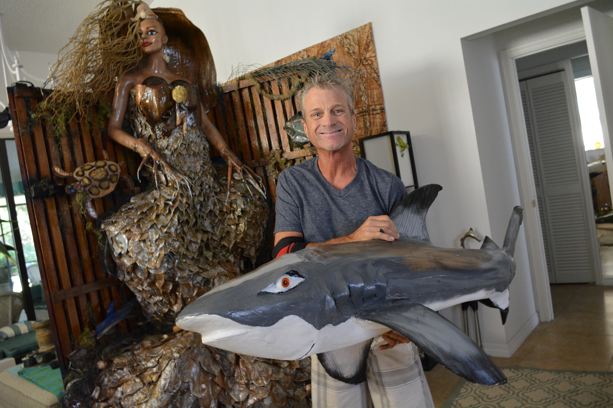 David Skaggs holds a dolphin he calls 