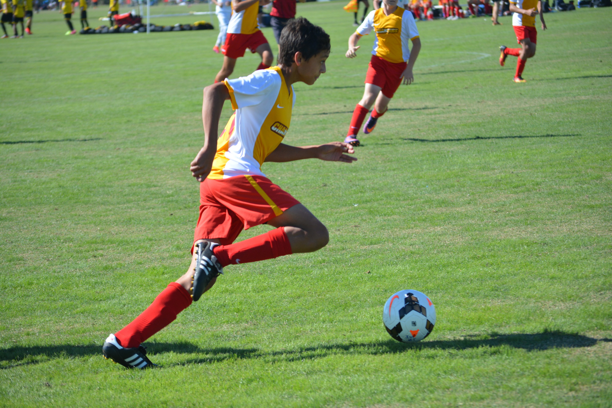 Lakewood Ranch Chargers U16 player Jaylen Besse dribbles the ball upfield.
