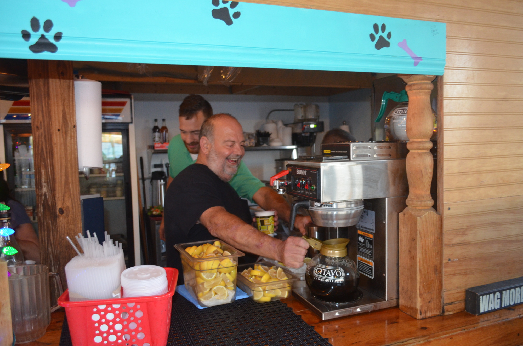 Mike Minks, forefront, and an unidentified employee, enjoy coffee at The Old Salty Dog. Minks has worked 28 years at The Old Salty Dog. Terry O'Connor