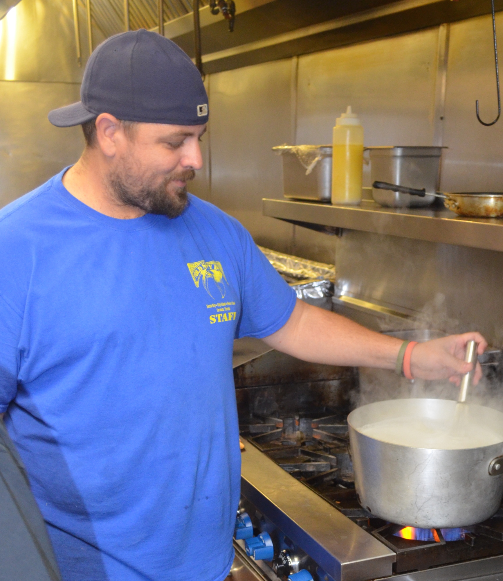 Manager Josh Shear, an 18-year veteran from Lakewood Ranch, starts the grits for breakfast at The Old Salty Dog. Terry O'Connor