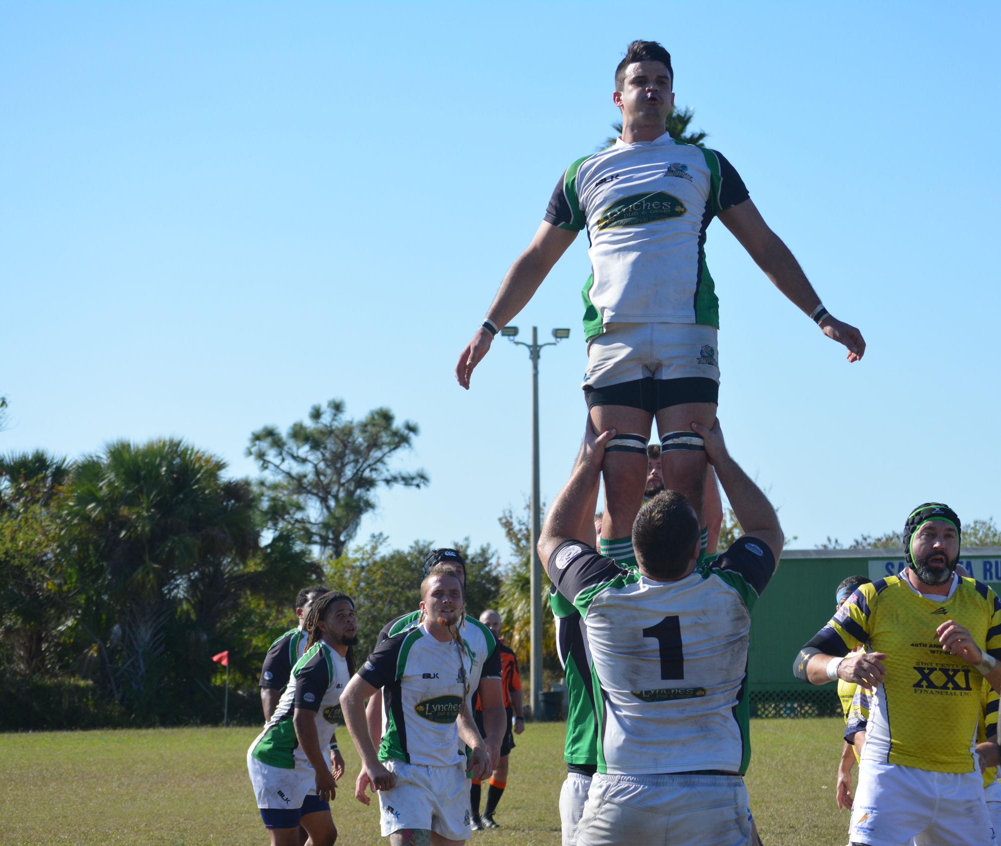 Steve Lahurd, lifted by DJ Coup, goes for the ball in a line-out.