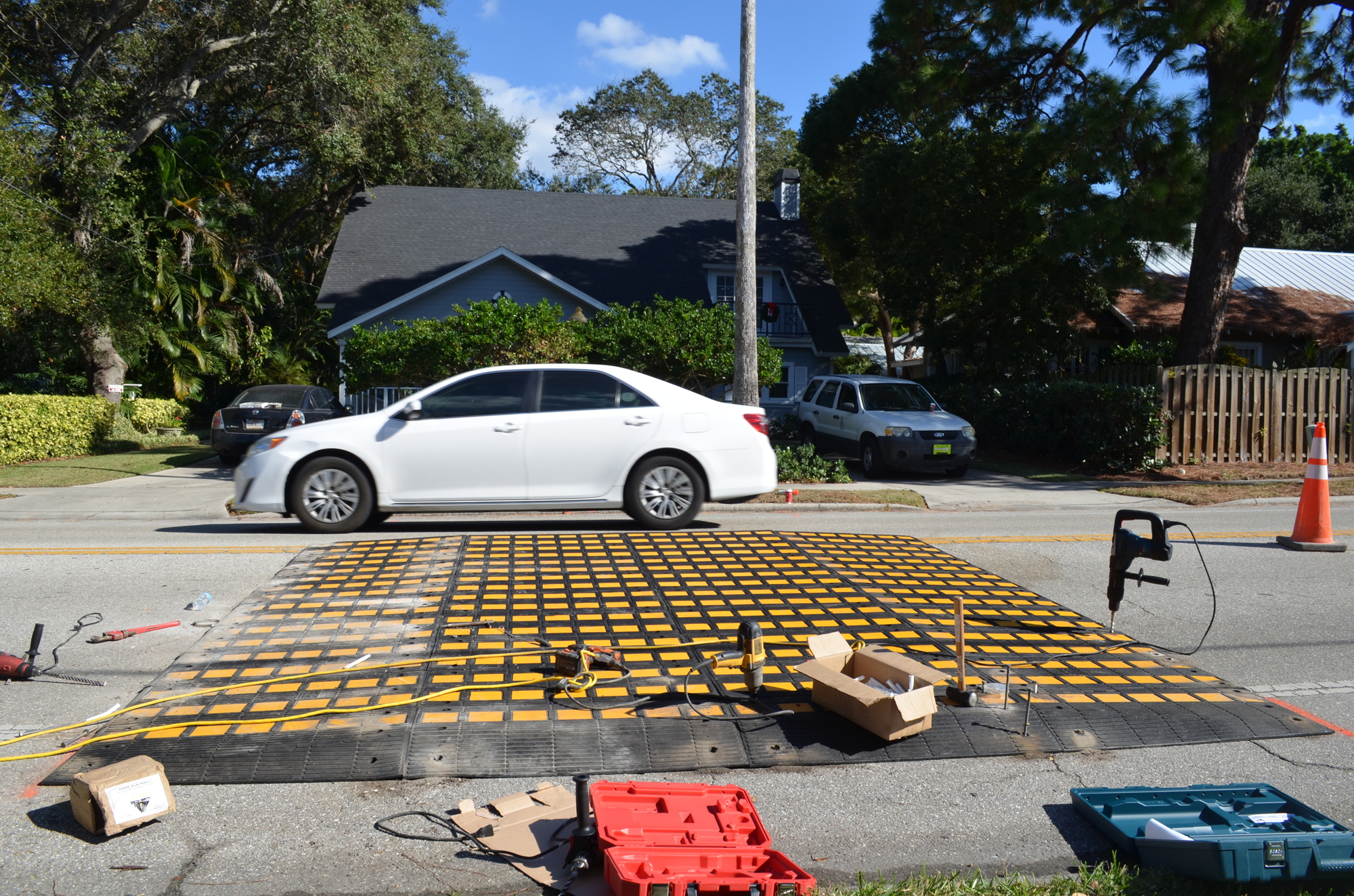 City workers spent Sunday installing a temporary speed table on Orange Avenue.