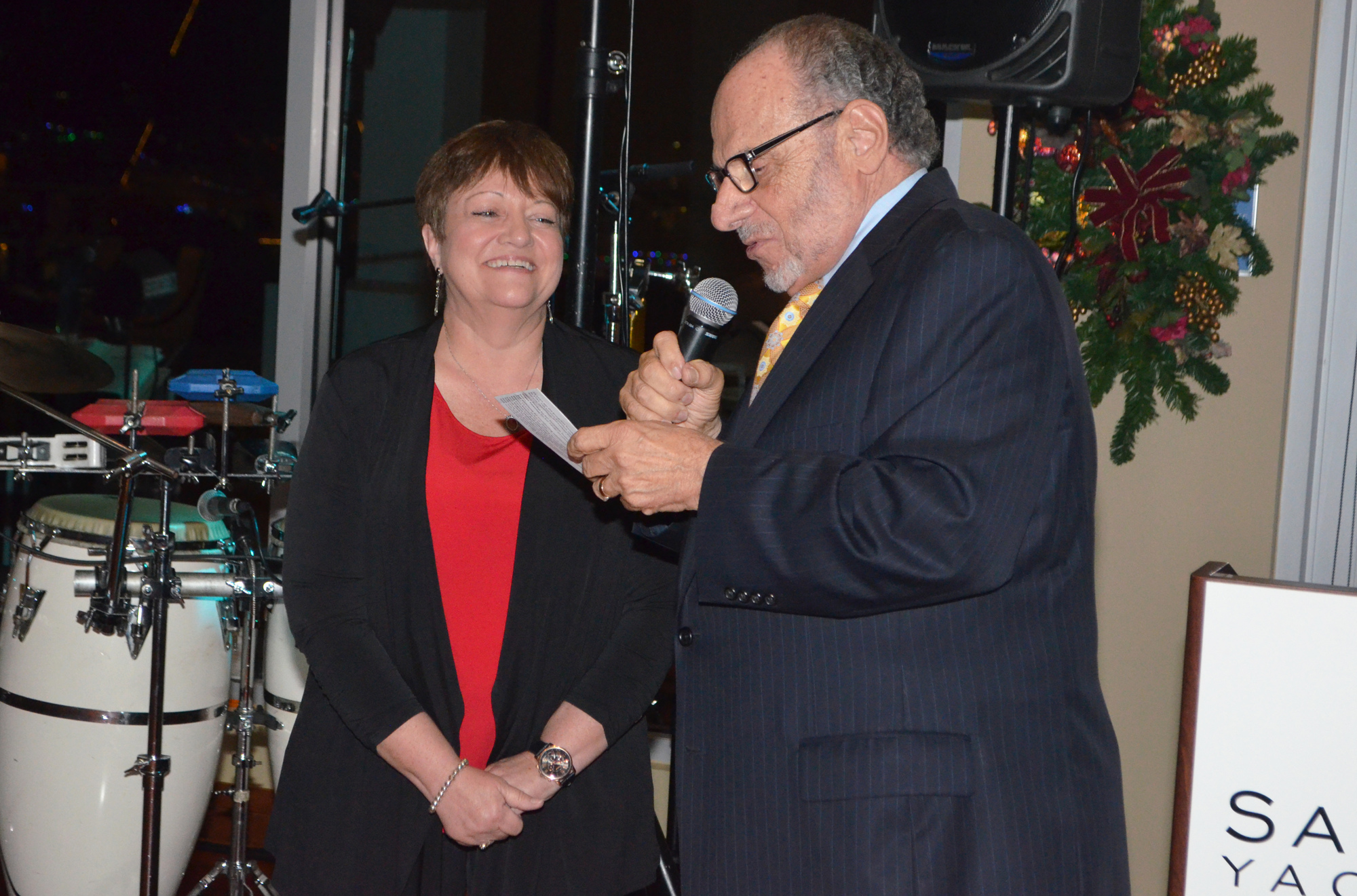 Honorary Chairman and Sarasota Ballet Executive Director Joe Volpe serenades outgoing Marketing and Development Director Janet Ginn with a song that he wrote earlier that day. Photo by Niki Kottmann