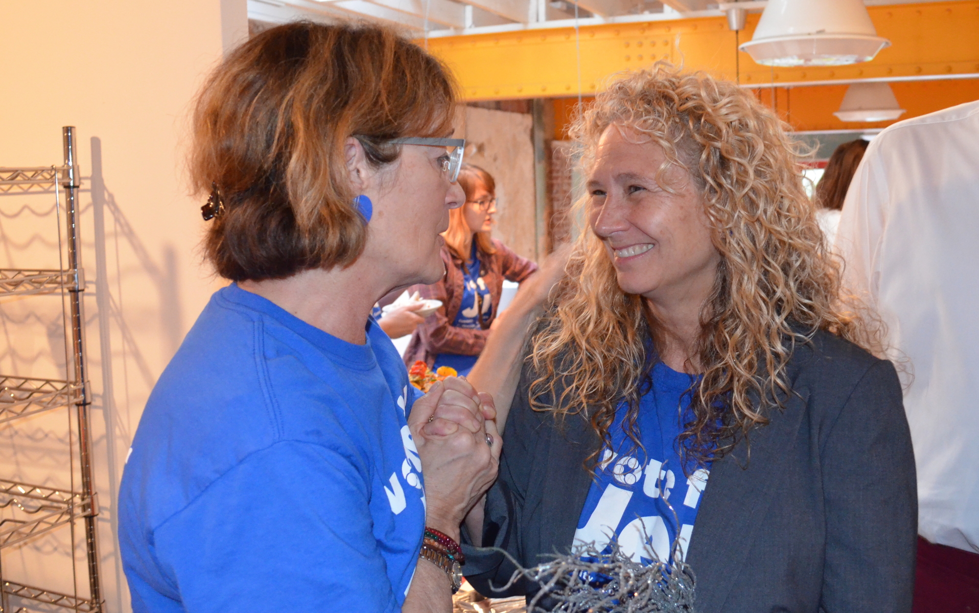 Jen Ahearn-Koch, right, celebrates the results Tuesday with campaign volunteer Kathy Kelley Ohlrich.