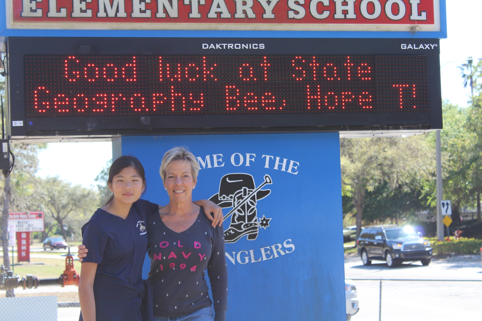 Braden River Elementary student Hope Tudor and her mom, Debra, enjoy the inspiration on her school’s message board.