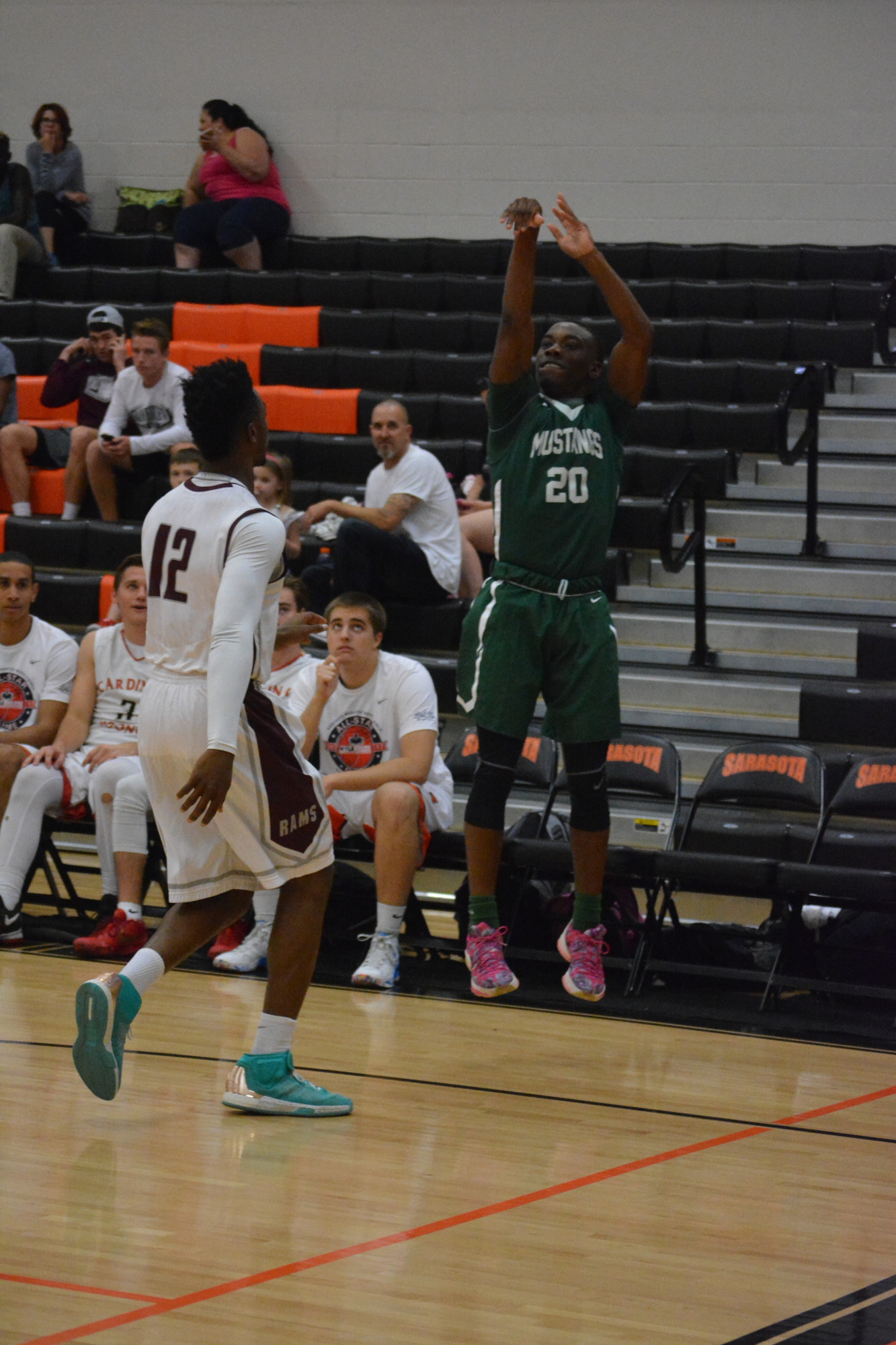 Lakewood Ranch's Devin Twenty hits a three over Riverview's Brion Whitley during the boys game.
