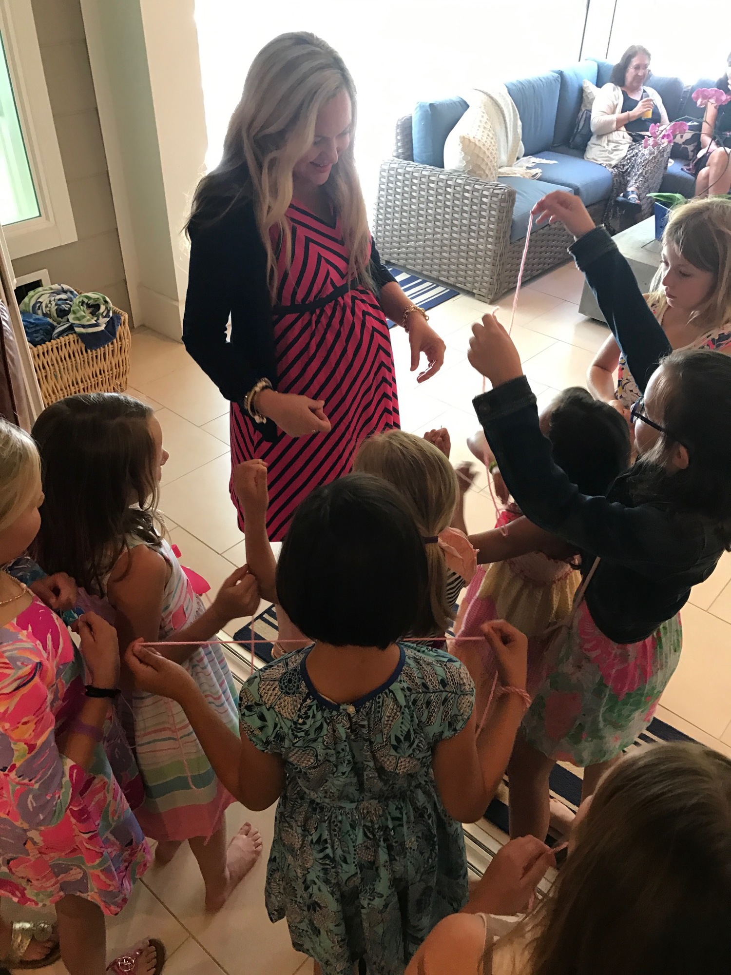 Brigid Saah greets the youngest guests at her baby shower on March 26 at the home of Beth Karins. Photo courtesy of Jessica Hays