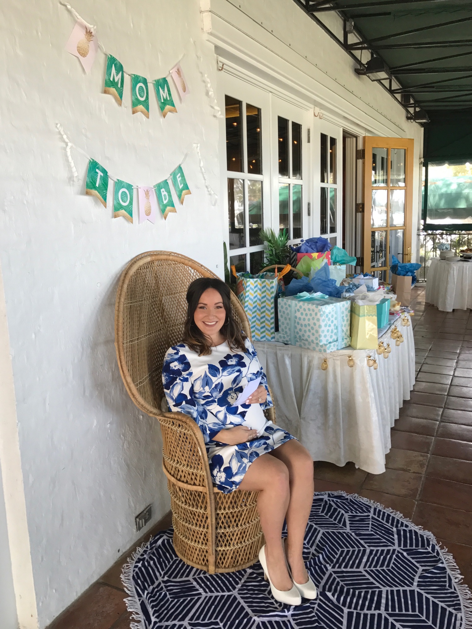 Allison Cornell enjoys her new nursery chair at her baby shower on April 1 at The Field Club. Photo courtesy of Allison Cornell