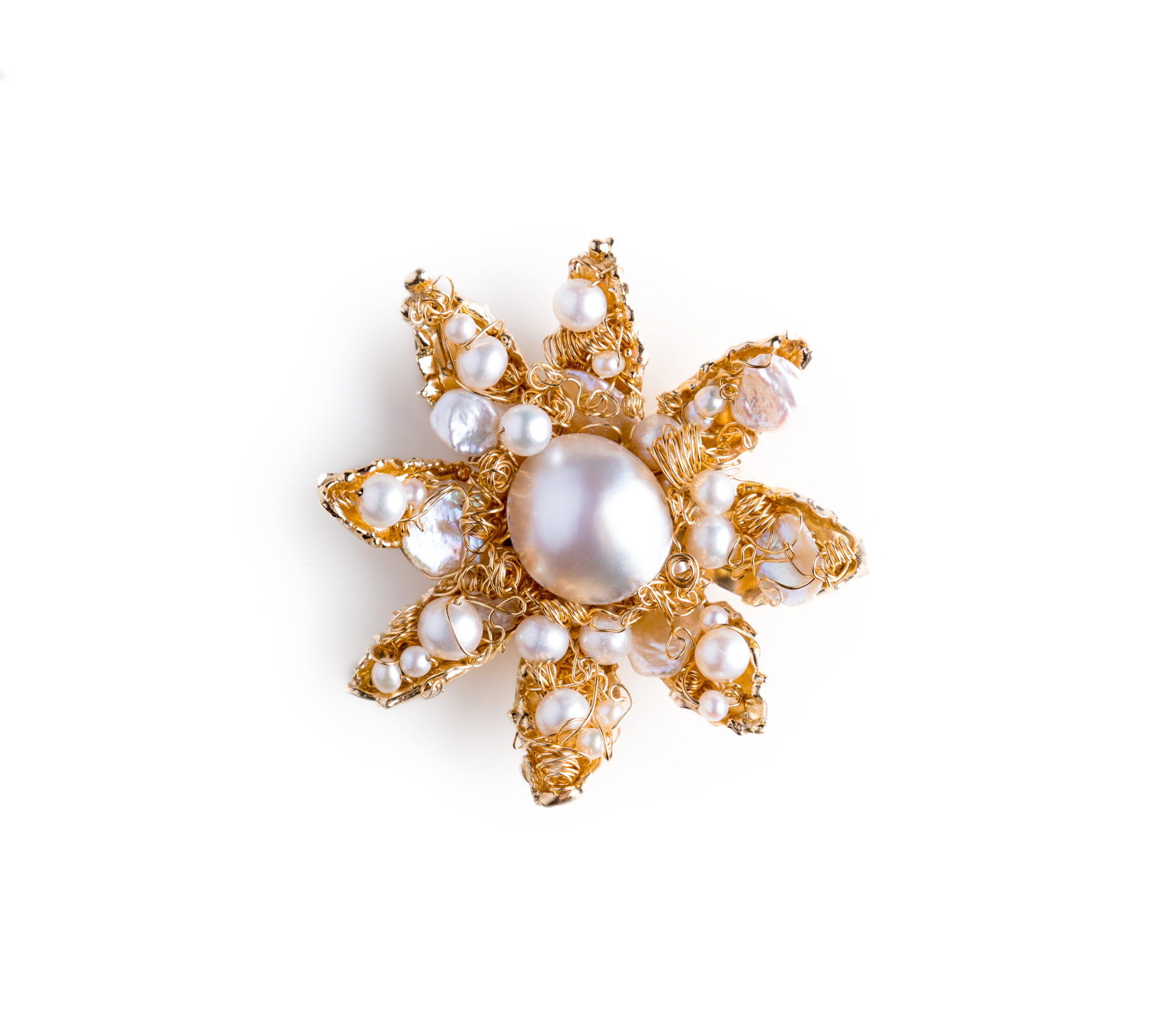 This gold-and-pearls brooch-pendant was created specifically for the upcoming Lunch in the Gardens: “Scents of the Riviera” by Nikki Sedacca. Photo courtesy of Molly Schechter