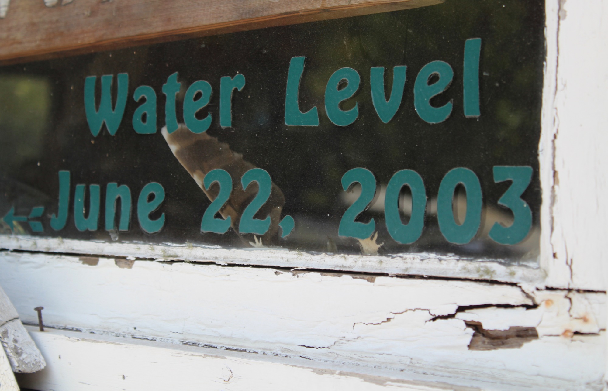 A sticker marks the water level, which reached the windows, at Ray's Canoe Hideaway during a flood in 2003.