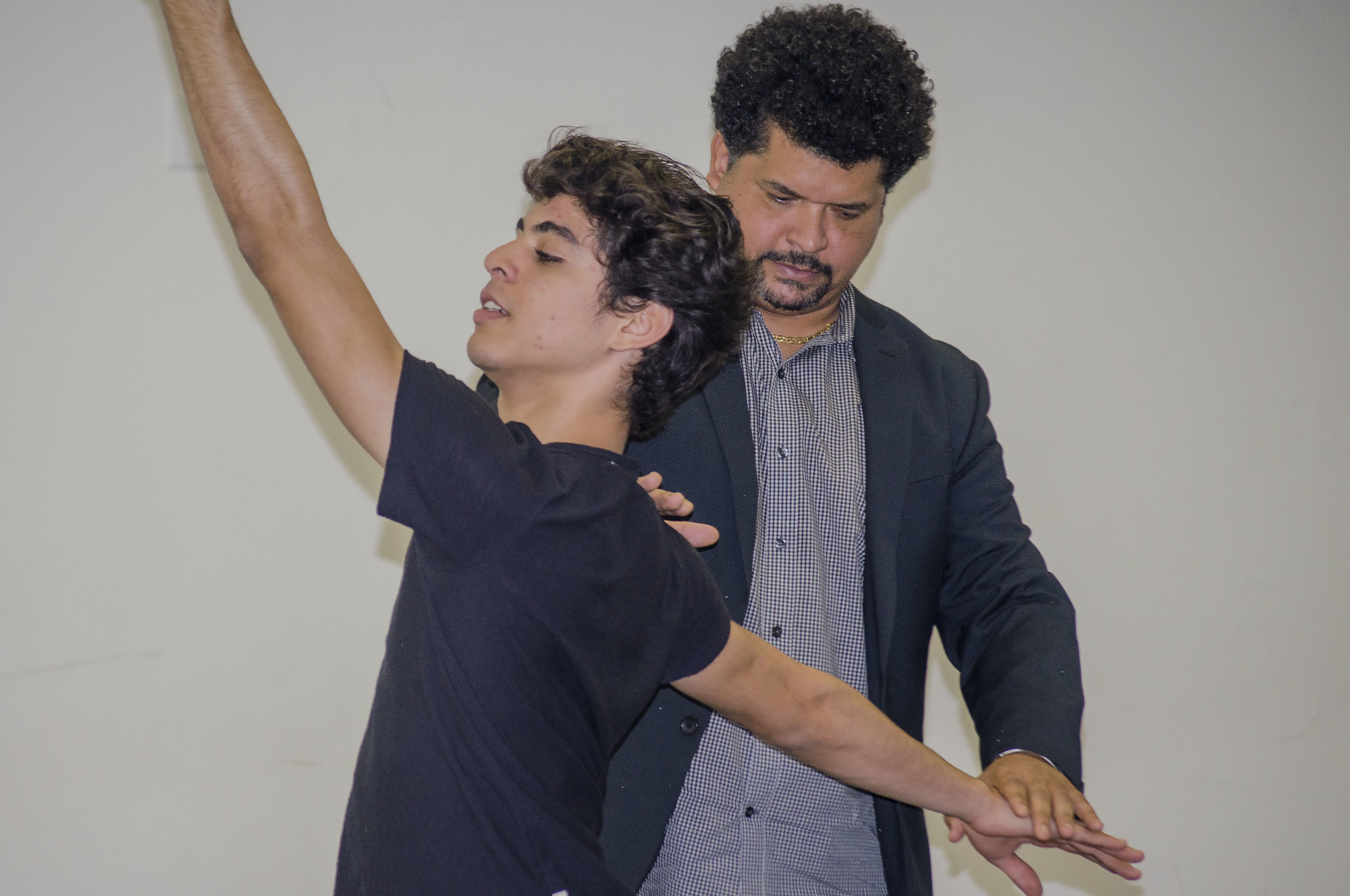 Ariel Serrano works with Francois Llorente at the Sarasota Cuban Ballet School