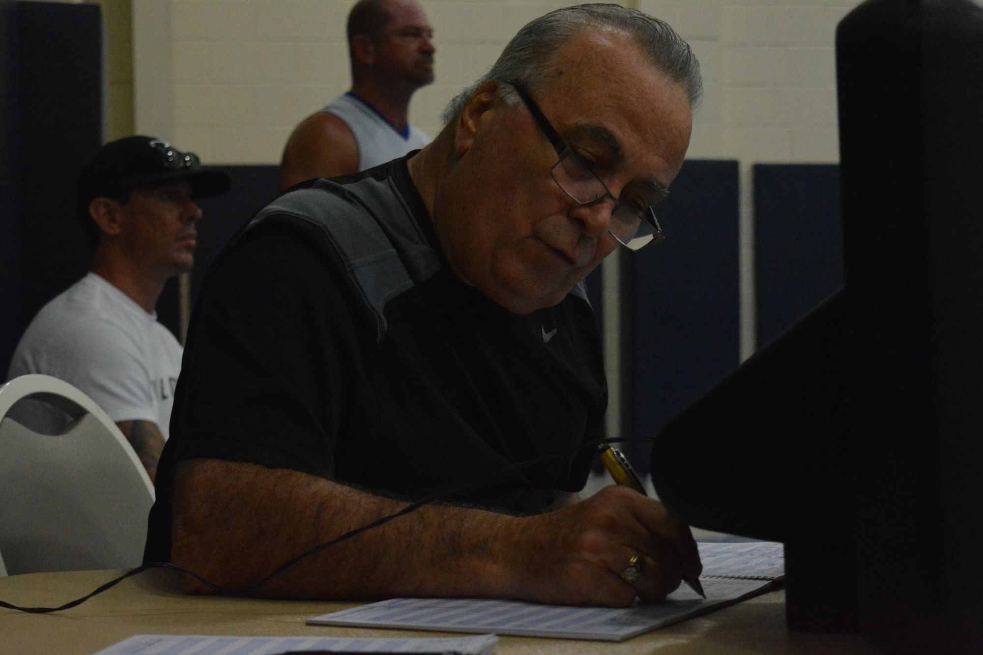 Dennis Bunker keeps score during the championship game.